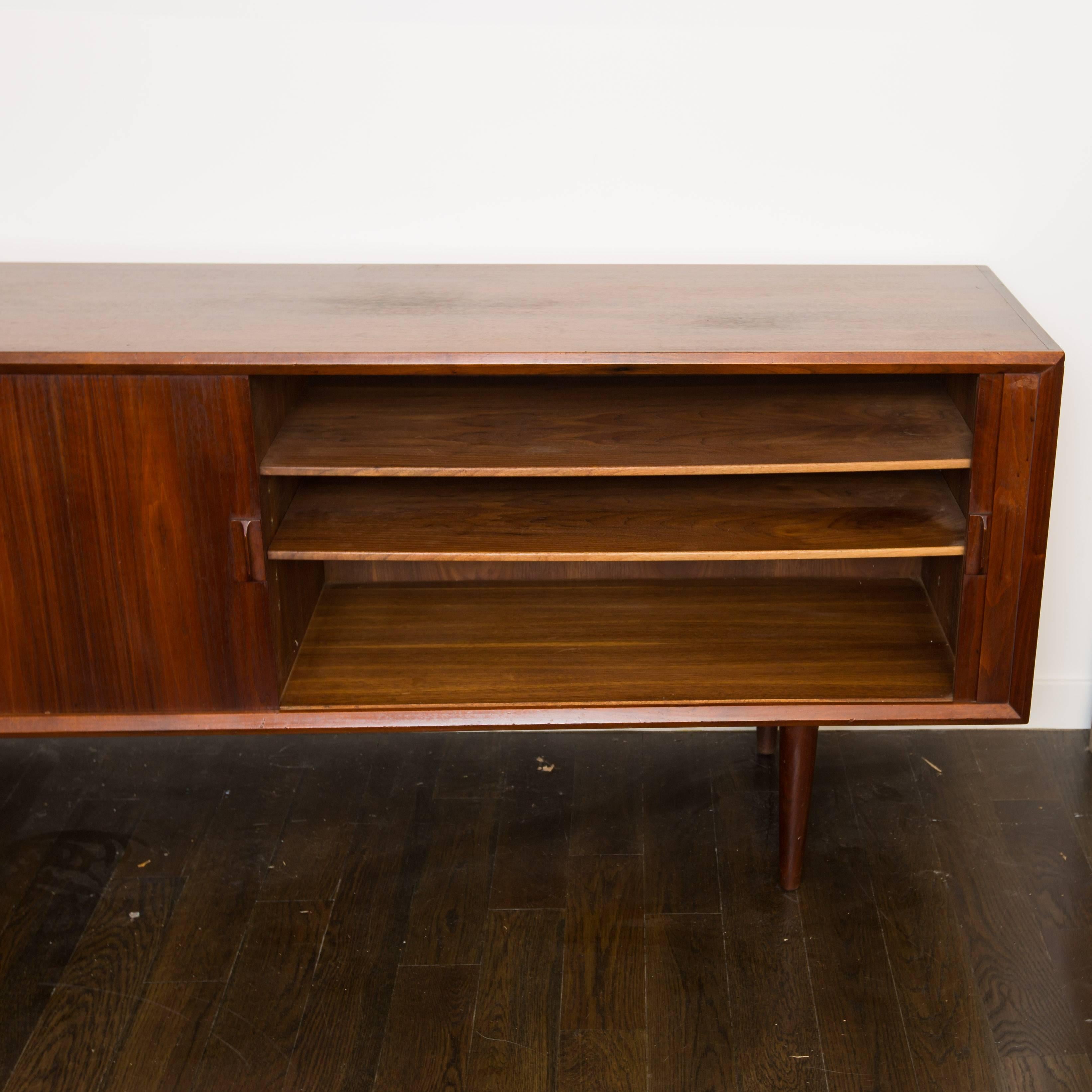 Extra long credenza in walnut with spectacular tambour doors that reveal plenty of storage.