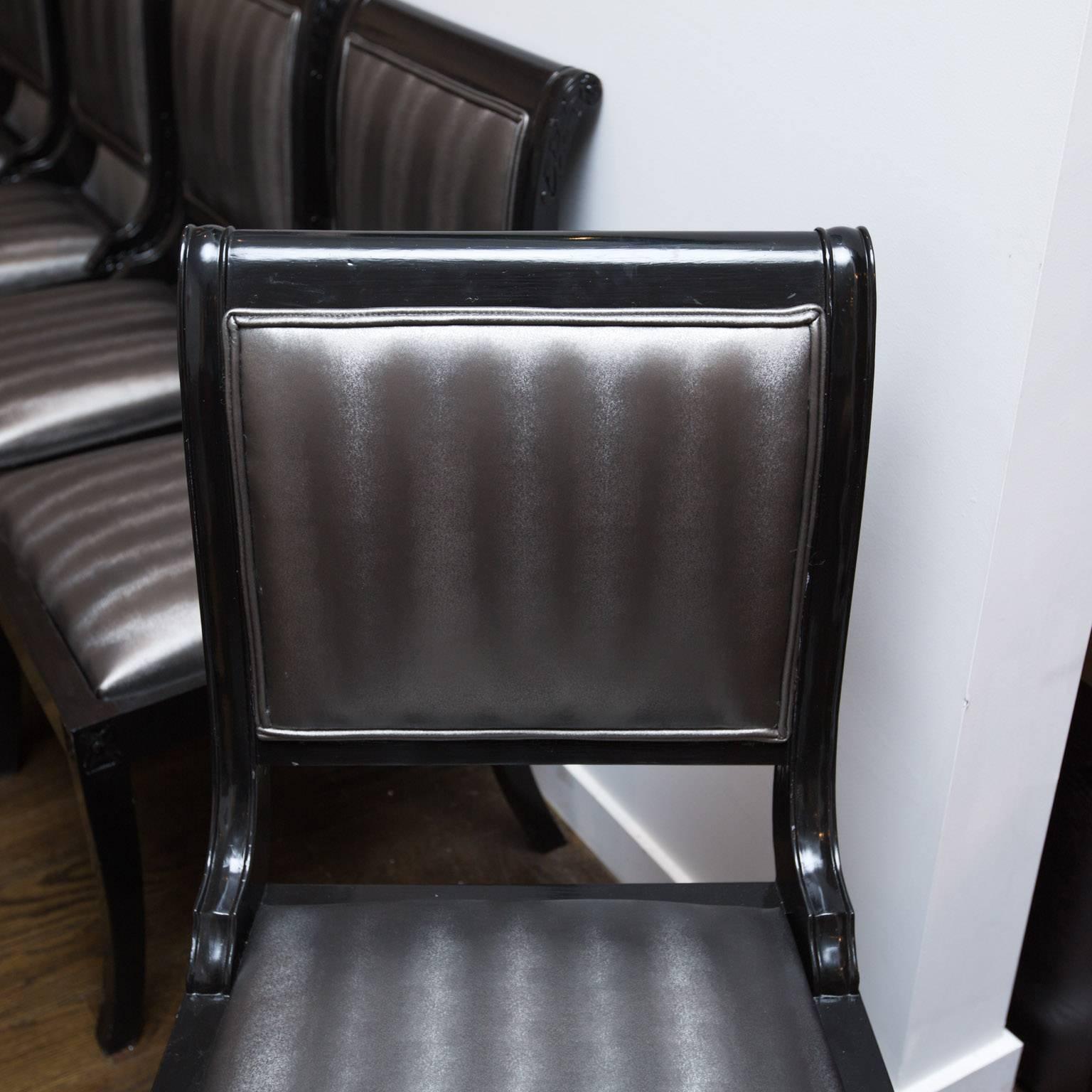 Set of nine ebony lacquered Regency-style dining chairs reupholstered in contemporary Kravet metallic upholstery.