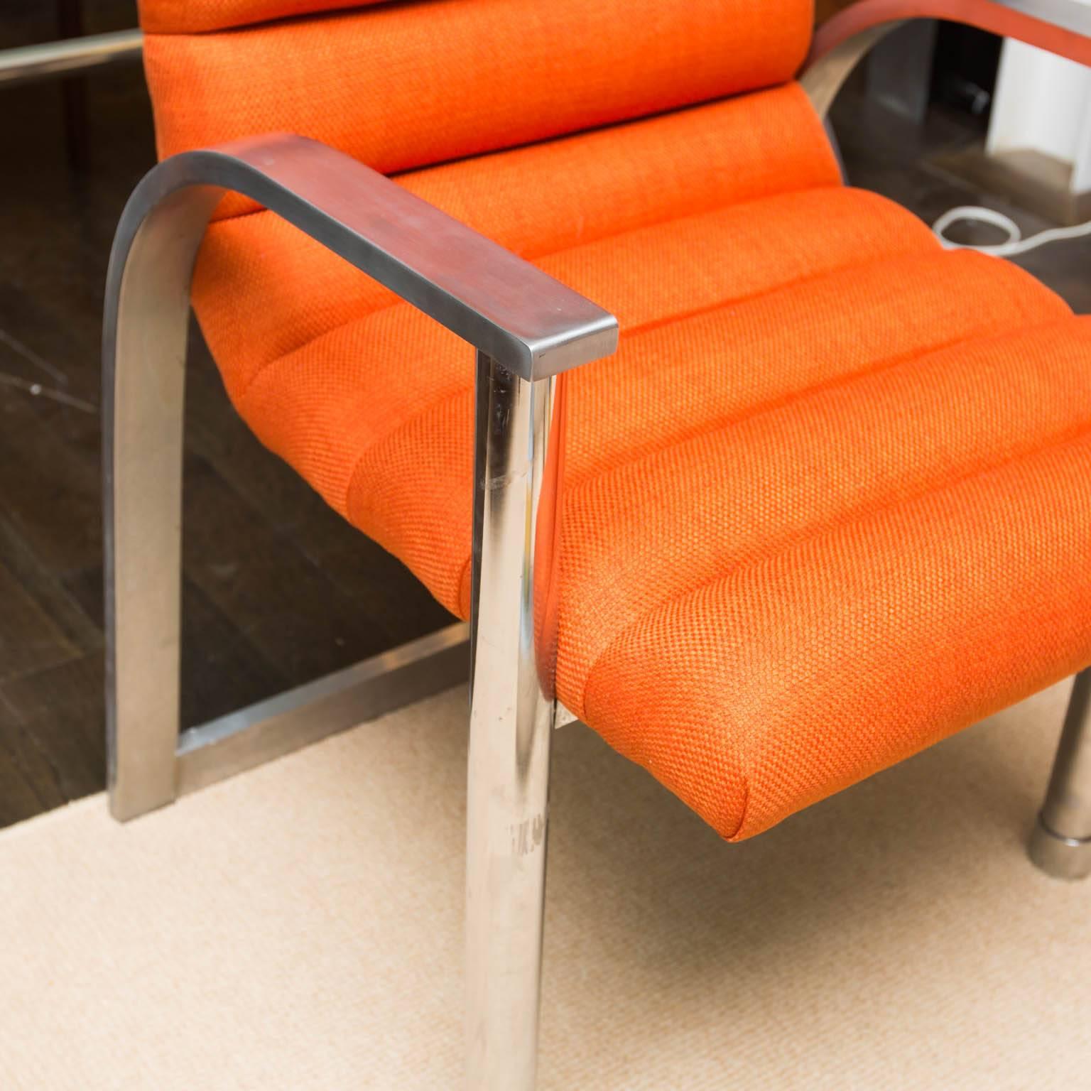 Just reupholstered in orange linen, this is a nicely constructed armchair made of heavy-gauge brushed stainless steel.