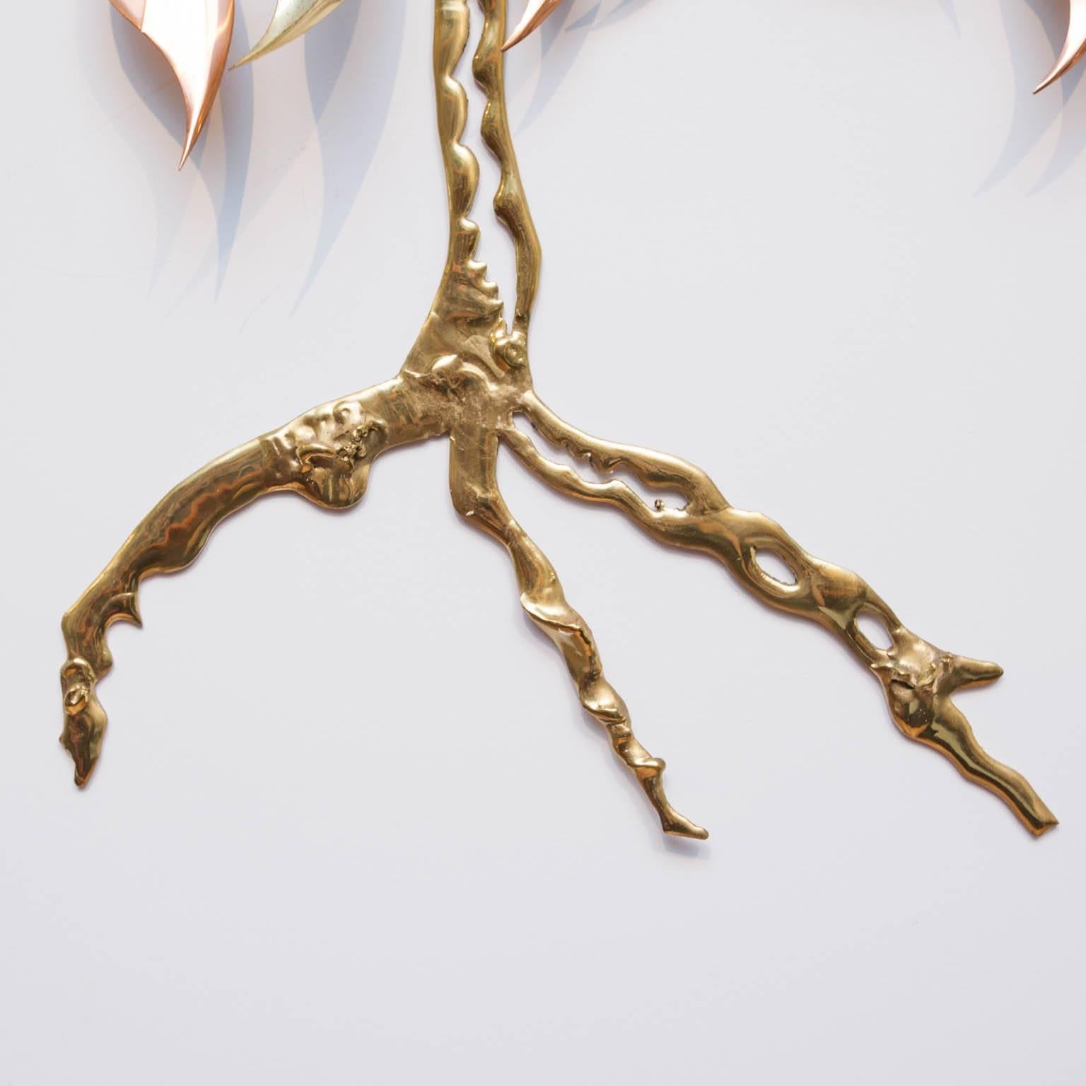 Dramatic Jere style sculpture of a tree with multi-metal leaves and a shiny brass trunk.