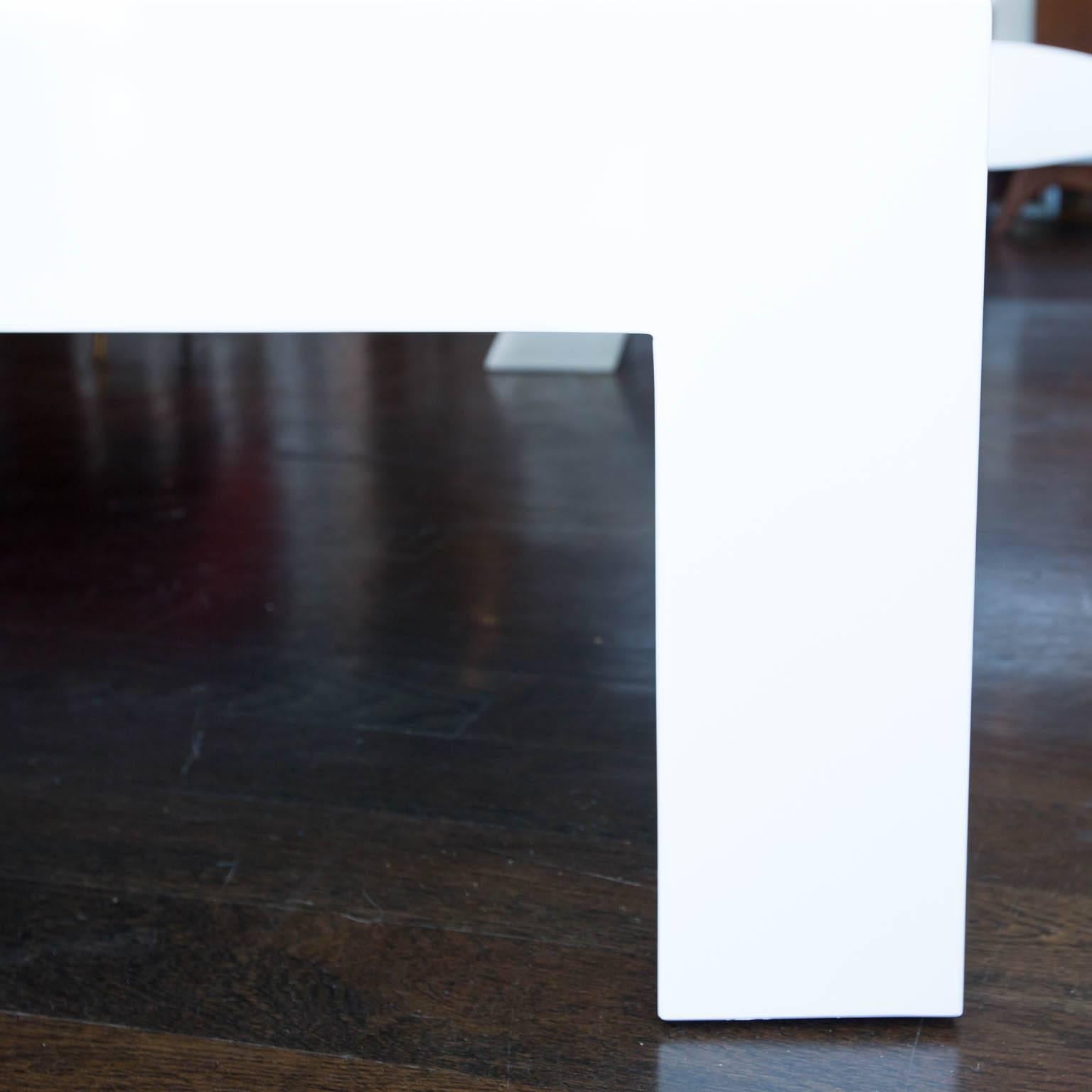 Custom-made coffee table with a white dove piano-finished lacquer.
