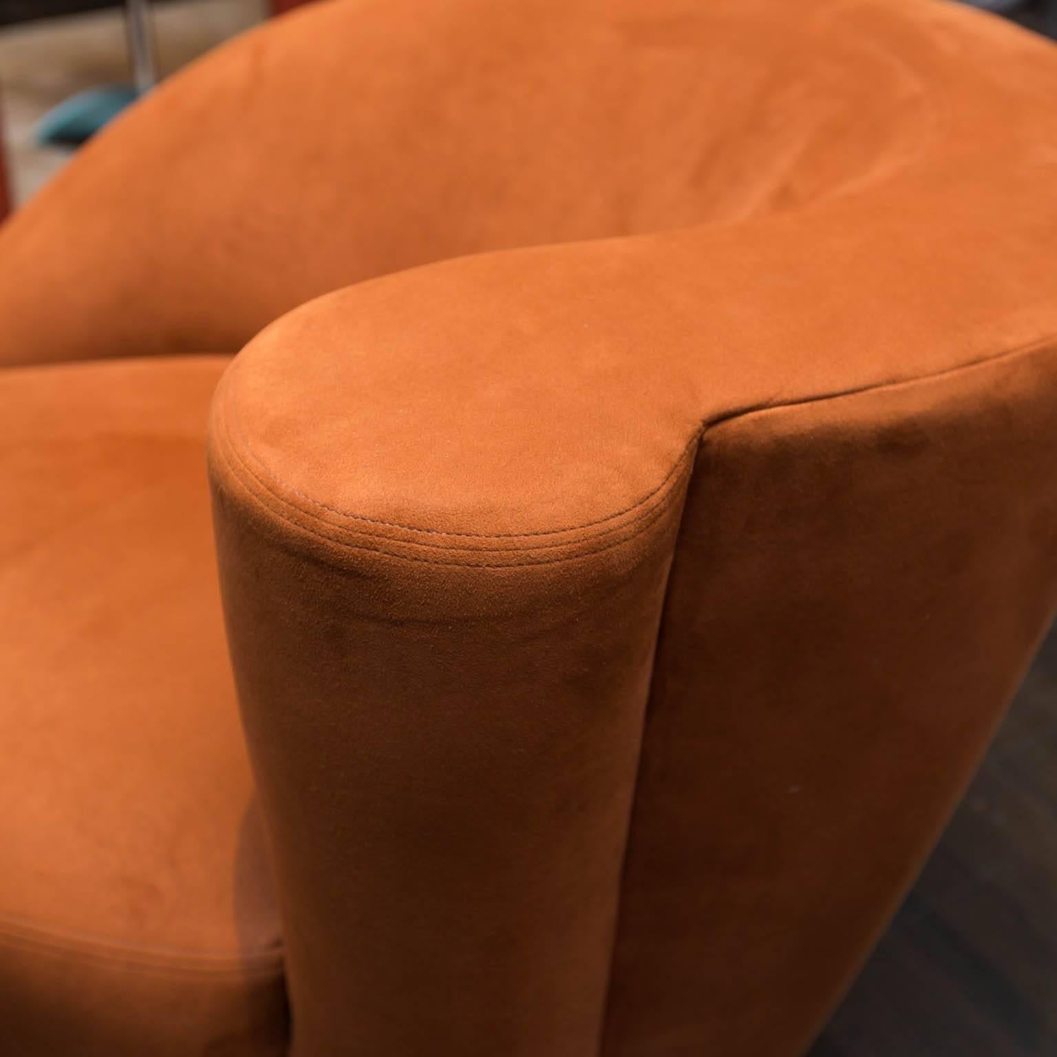 Nice pair of Kagan Nautilus swivel chairs in burnt orange ultrasuede.