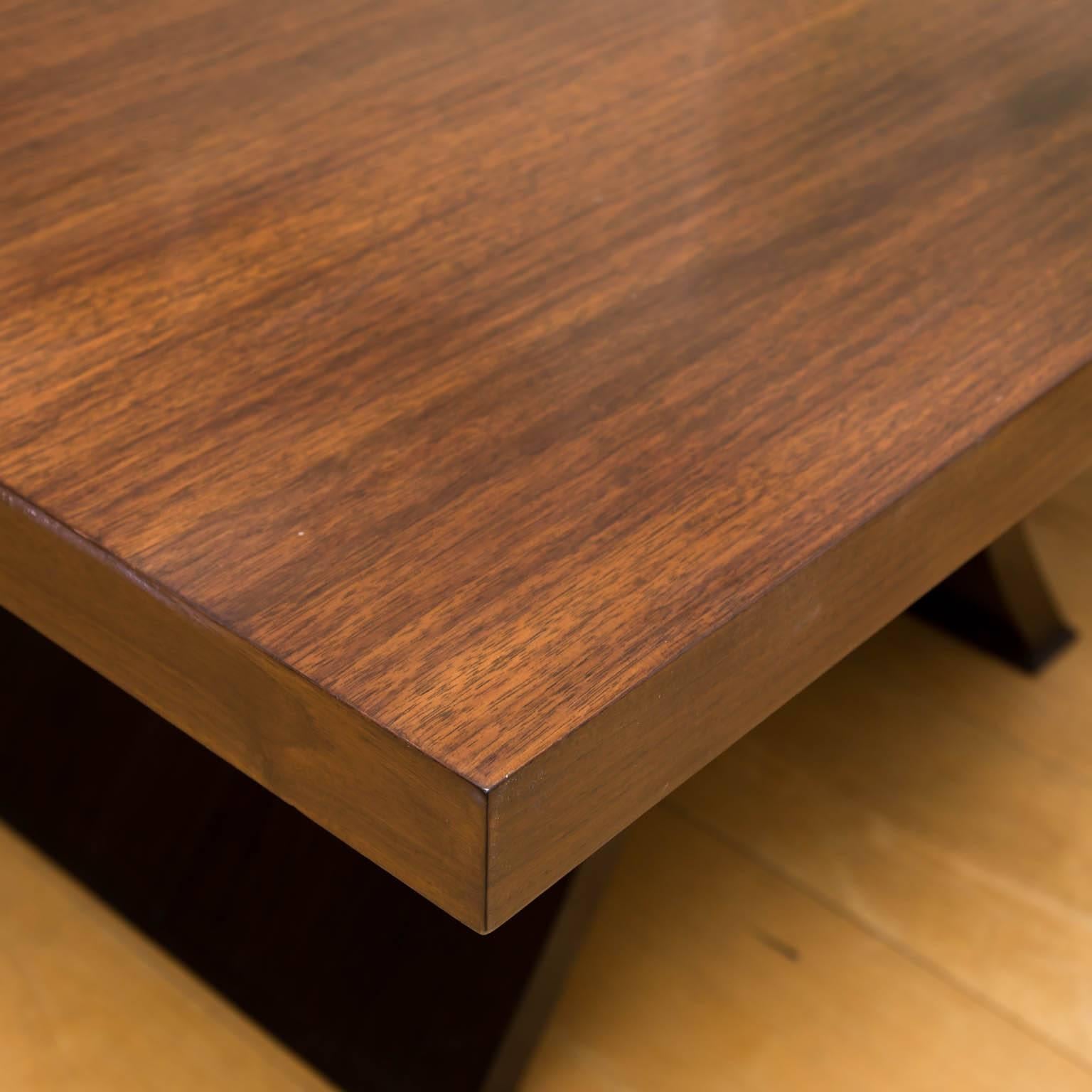Bookmatched walnut veneers and bentwood pedestals make this dining table stand out from the norm.