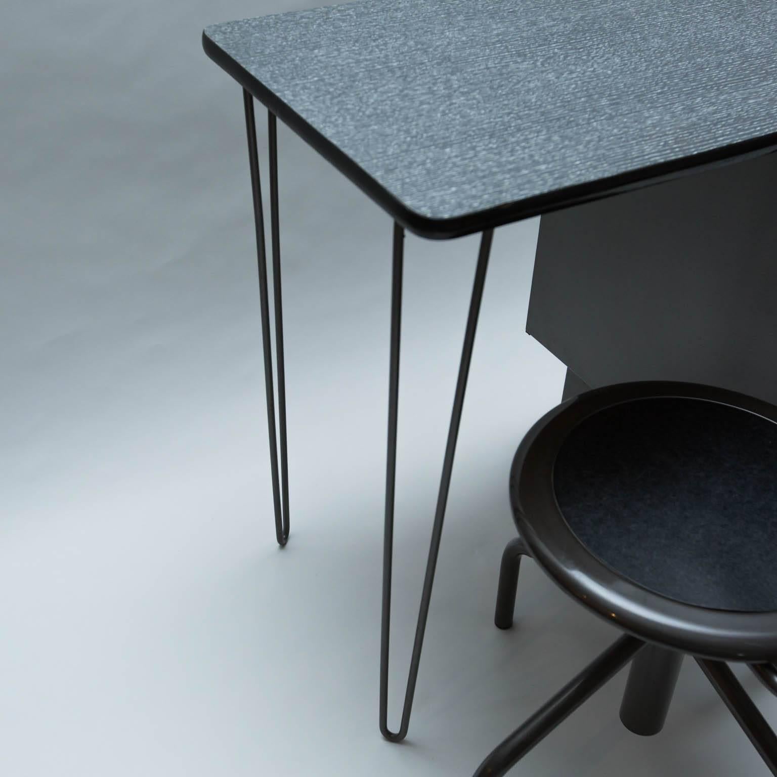 Rare, Mid-Century Modern metal desk with cerused-effect formica top and hairpin side legs, matched with a vintage metal swivel desk/drafting chair that is height adjustable. Chair measures: 17