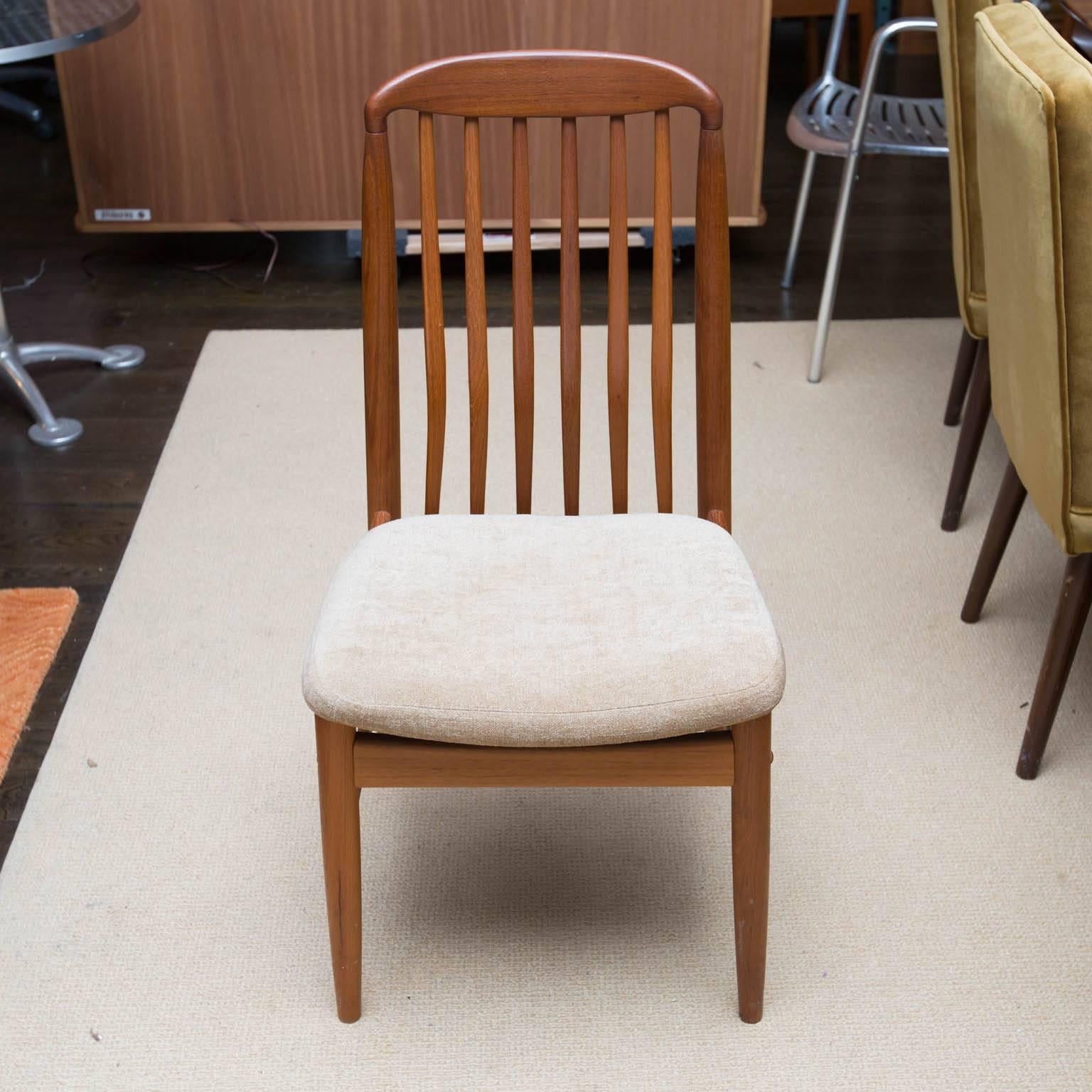 Great set of teak dining chairs with high backs in the manner of Benny Linden. Newly reupholstered.