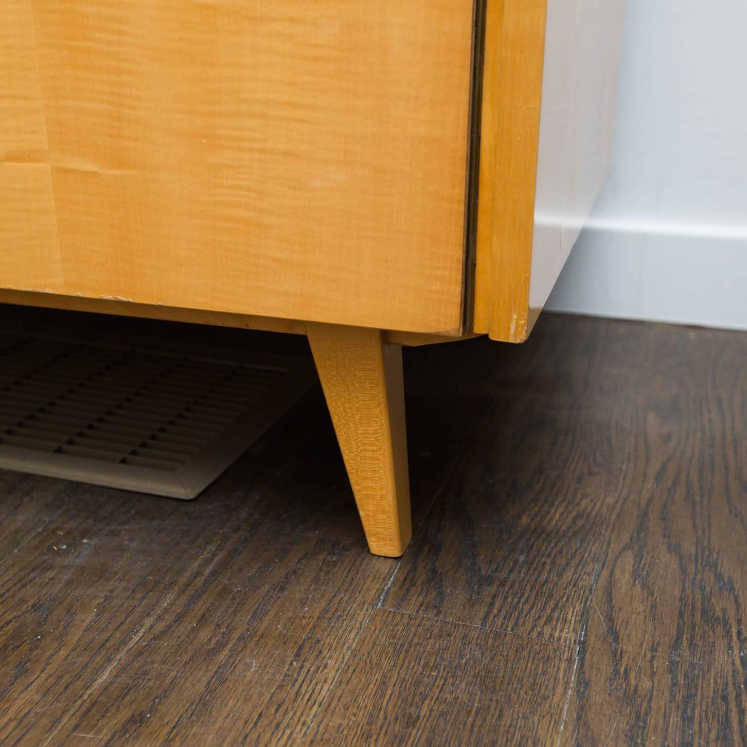 Spectacular use of mother nature's coolest wood veneers. Blond mahogany top and sides and book matched tiger maple front with darker tiger maple interior. Clean, handsome and functional. Lockable doors but no keys.