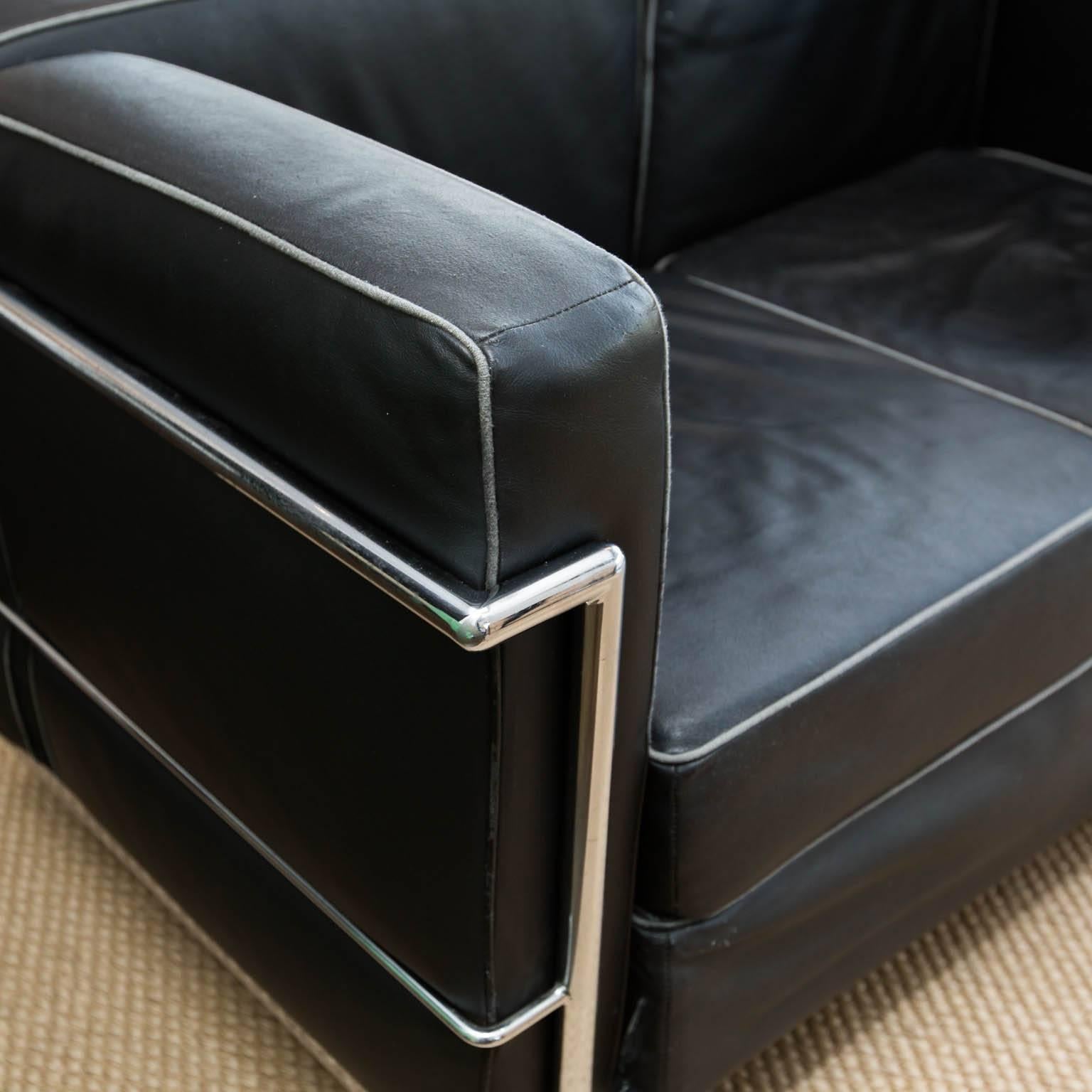 Nice reproduction in black leather with light grey fabric piping.