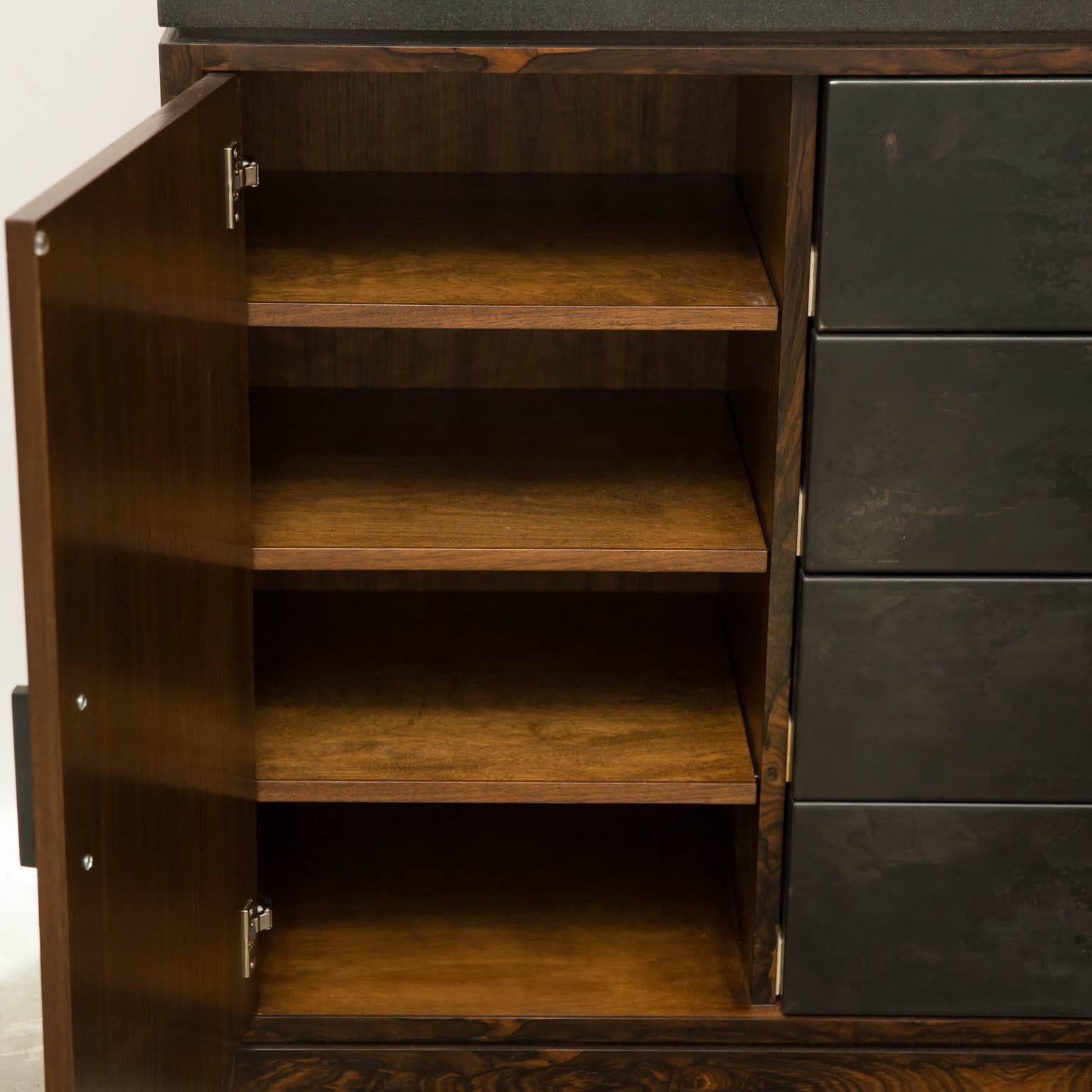 Dramatic custom piece by Gregory Clark with black granite top, zircote wood doors and frame with patinated steel drawers. Doors feature soft close hinges and drawers have self-closing runners. Cool storage worthy of your equally cool wardrobe.
