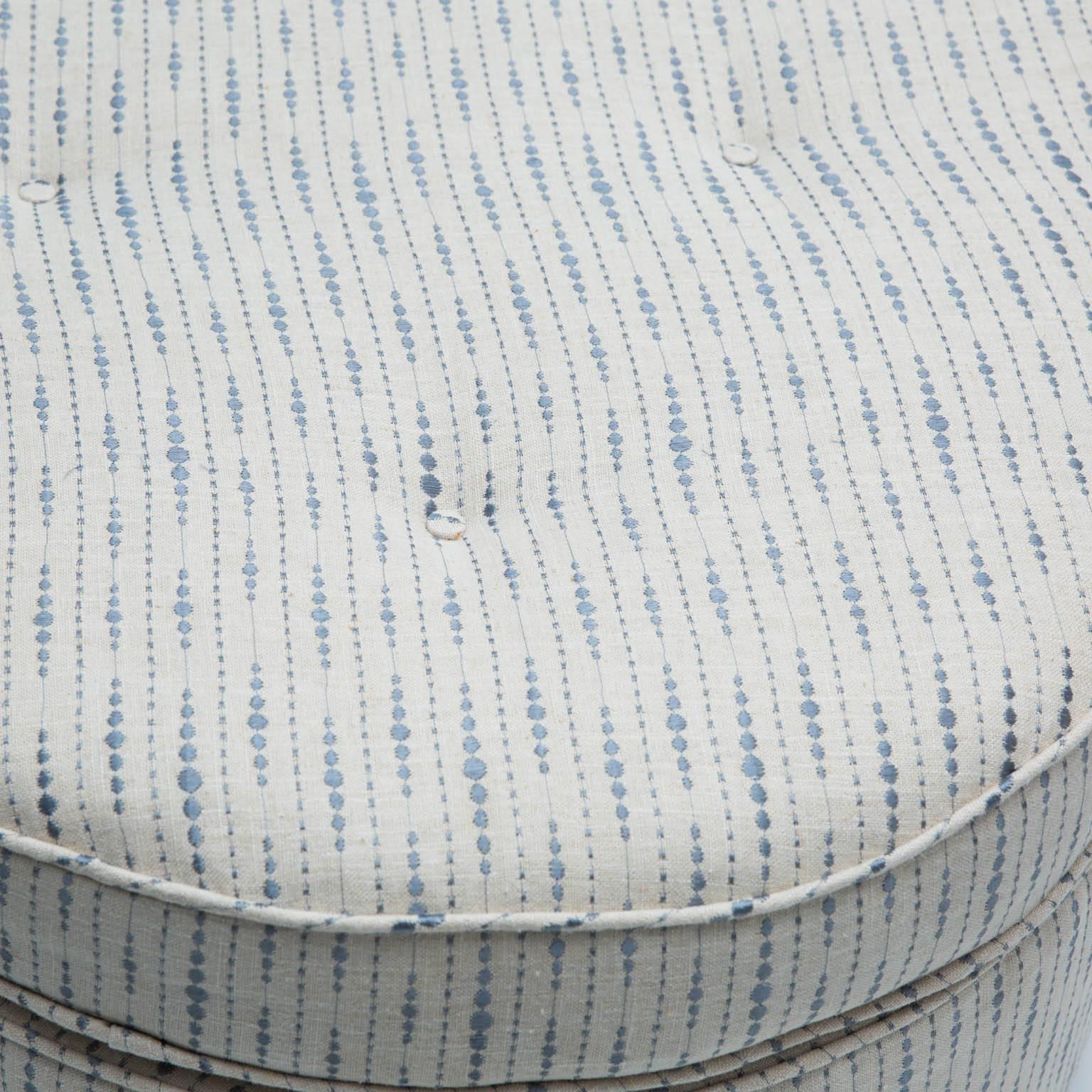 Newly upholstered ottoman with hidden wheels for ease of movement.