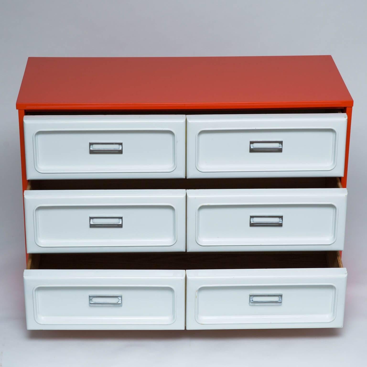 Fun three drawer dresser with 70s era plastic fronts and chrome drawer pulls. Freshly lacquered top and sides. 