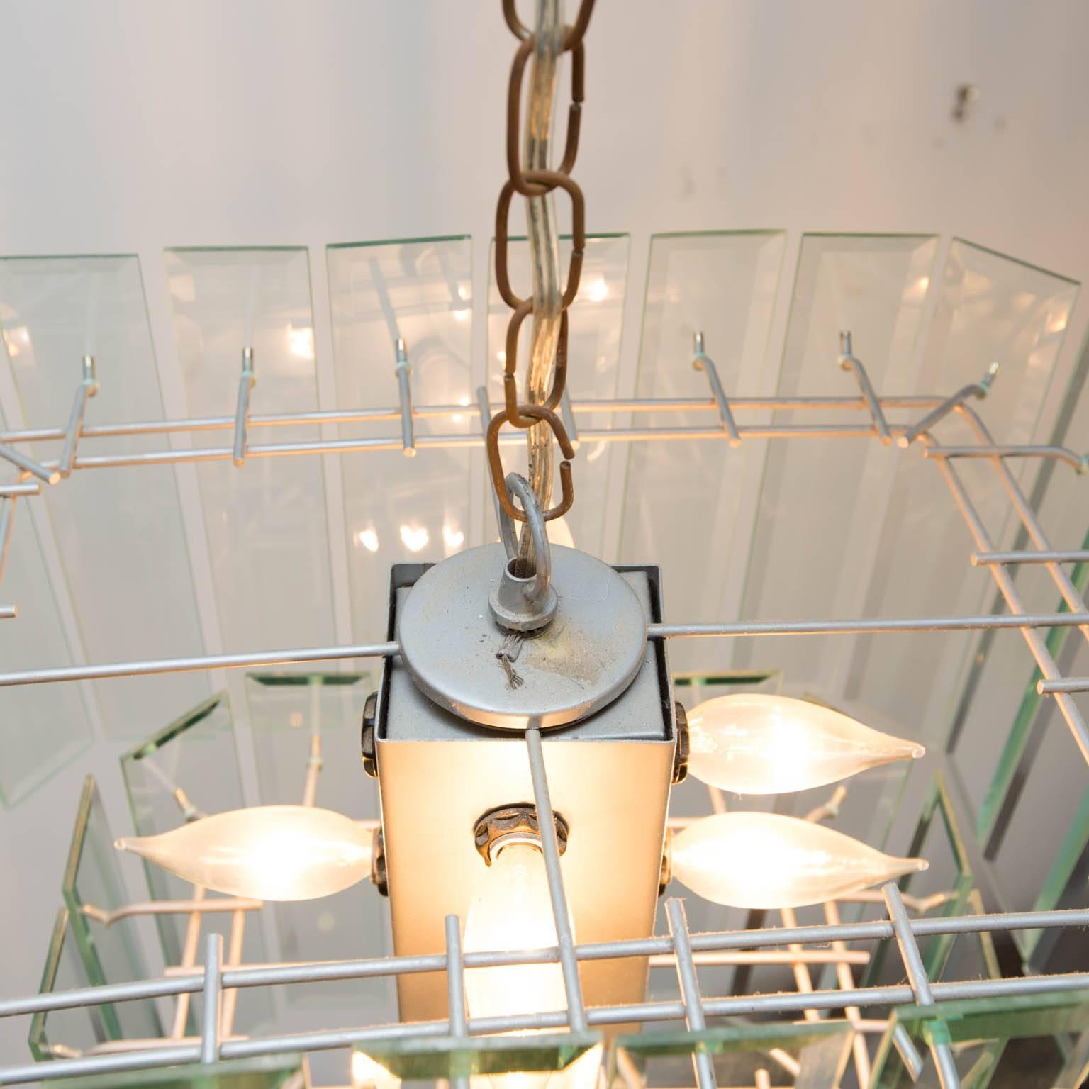 Vintage chandelier made up of 40 vertical, bevelled-glass prisms: 24 on top tier, 16 on lower tier.
