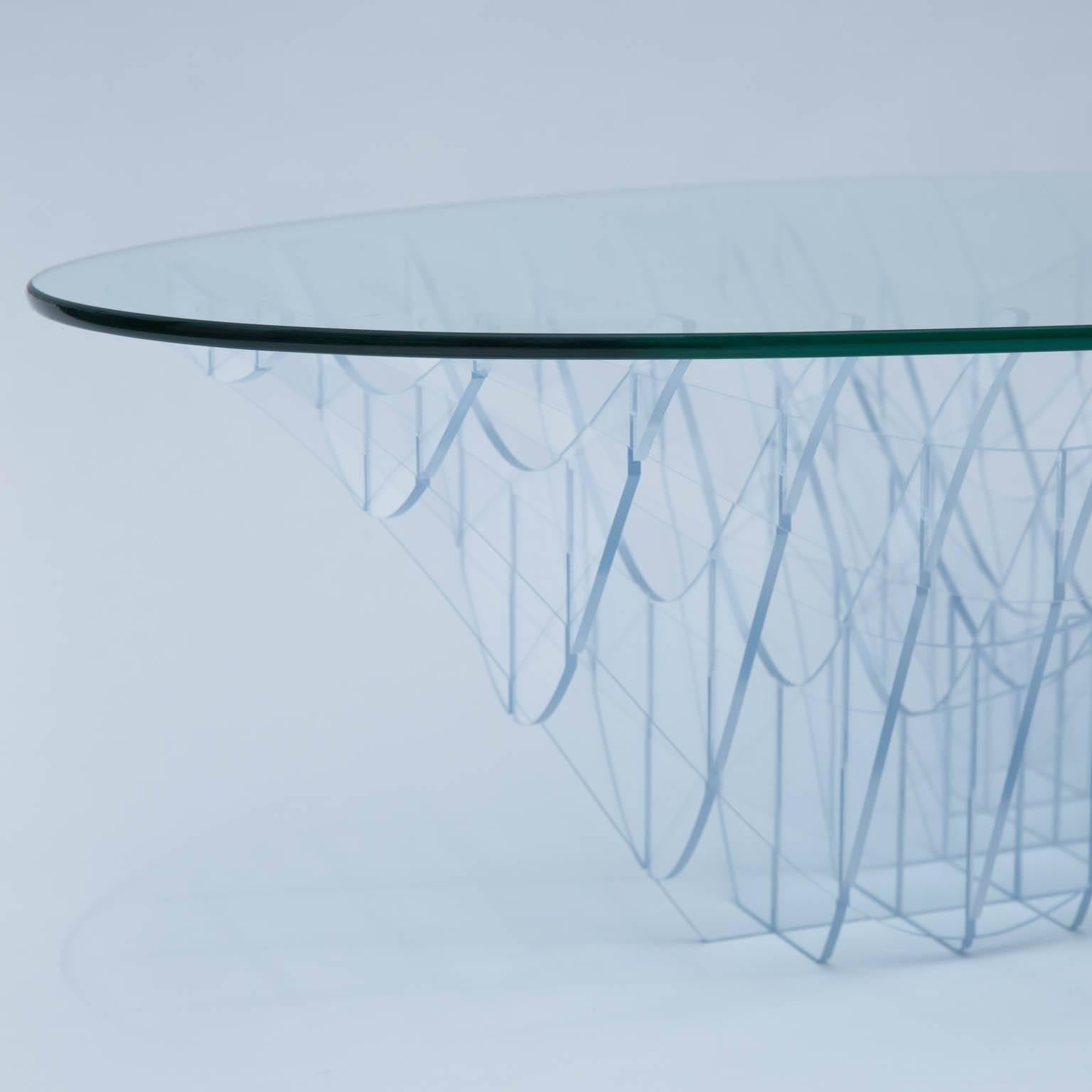 This table uses two simple materials to create an organic, curved and endlessly fascinating work of sculpture. 

It was designed as a prototype to explore the viability of more furniture like it. It is the first one and is signed by the artist.