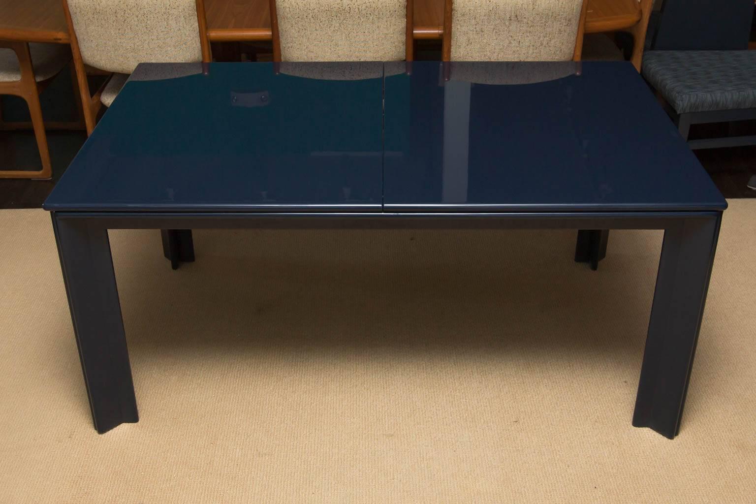 Once a black lacquered table from the 1970s, this piece is now newly lacquered in a nice deep dark navy blue. Table measures 63.5