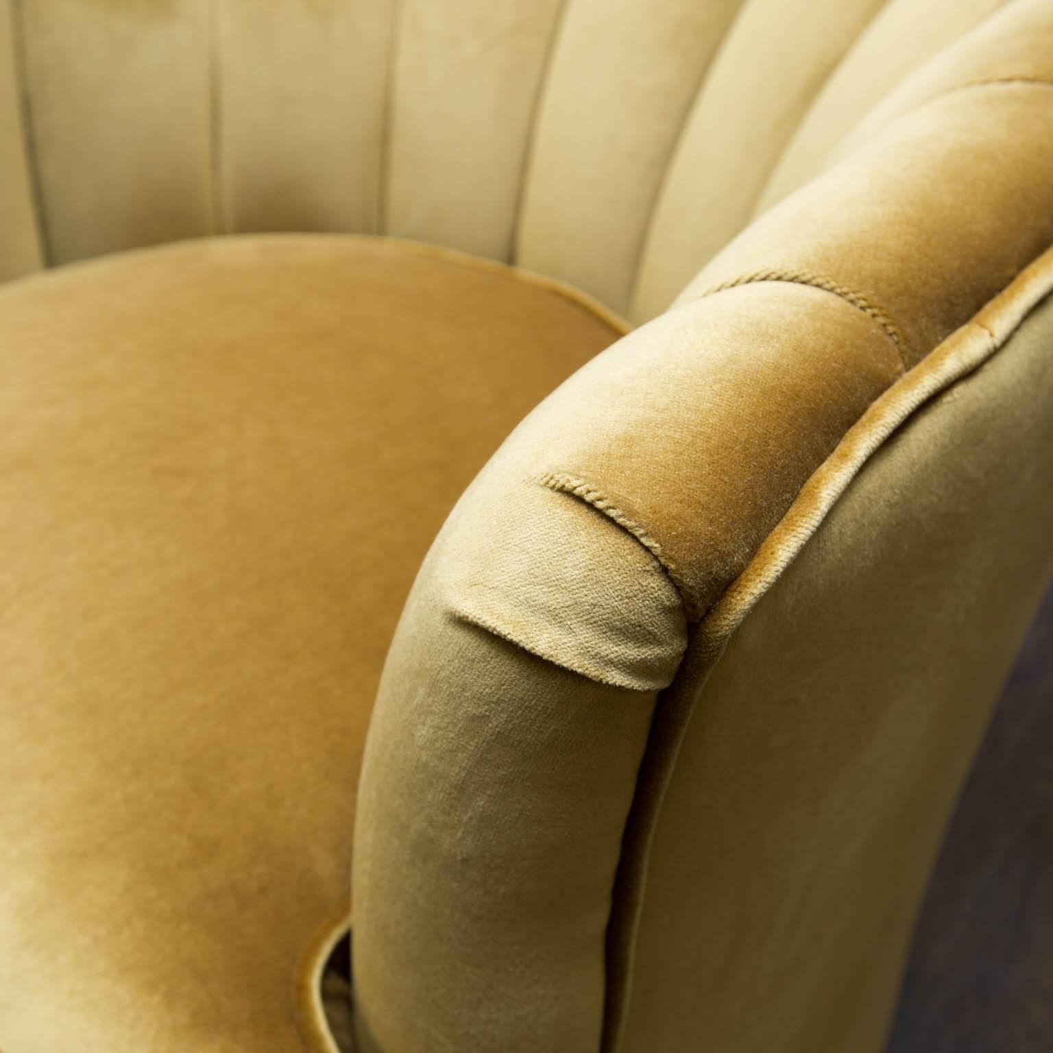 Freshly reupholstered in gold velvet, these fifties-era swivel chairs are ready for another 60 years.