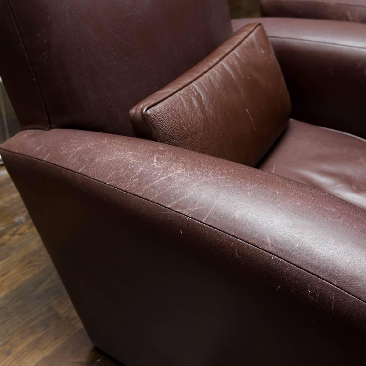 Masculine lines in a chocolate Holly Hunt leather. Chairs feature separate leather lumbar pillows. Price is per chair.