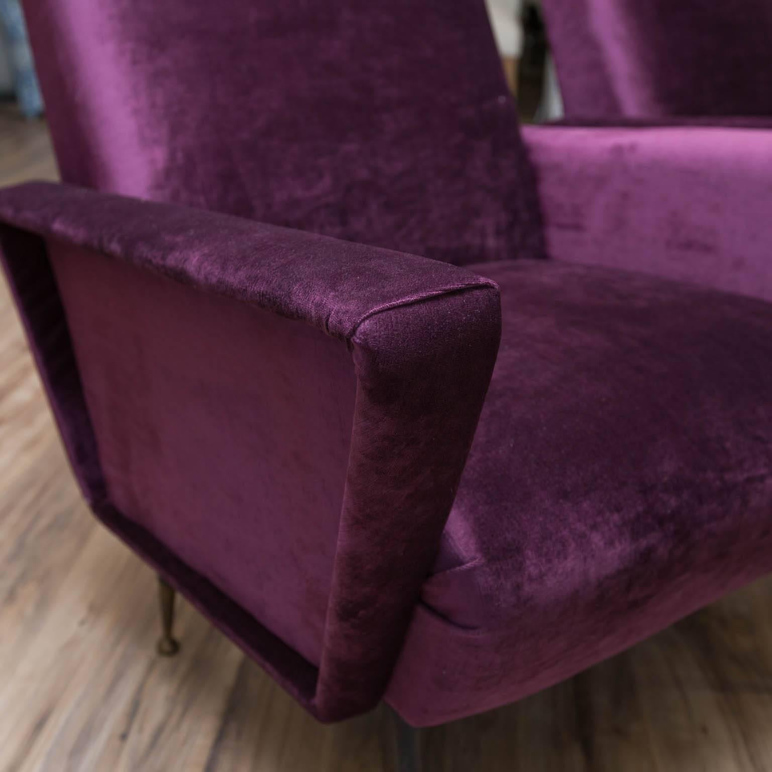 A vintage set of chairs in the manner of Marco Zanuso, but offer a refreshing change from the curved arms of his Lady chair. Just reupholstered in purple velvet.
