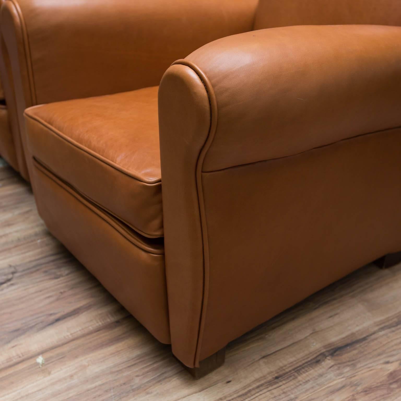 Classic French deco style club chairs in new tan nappa leather.