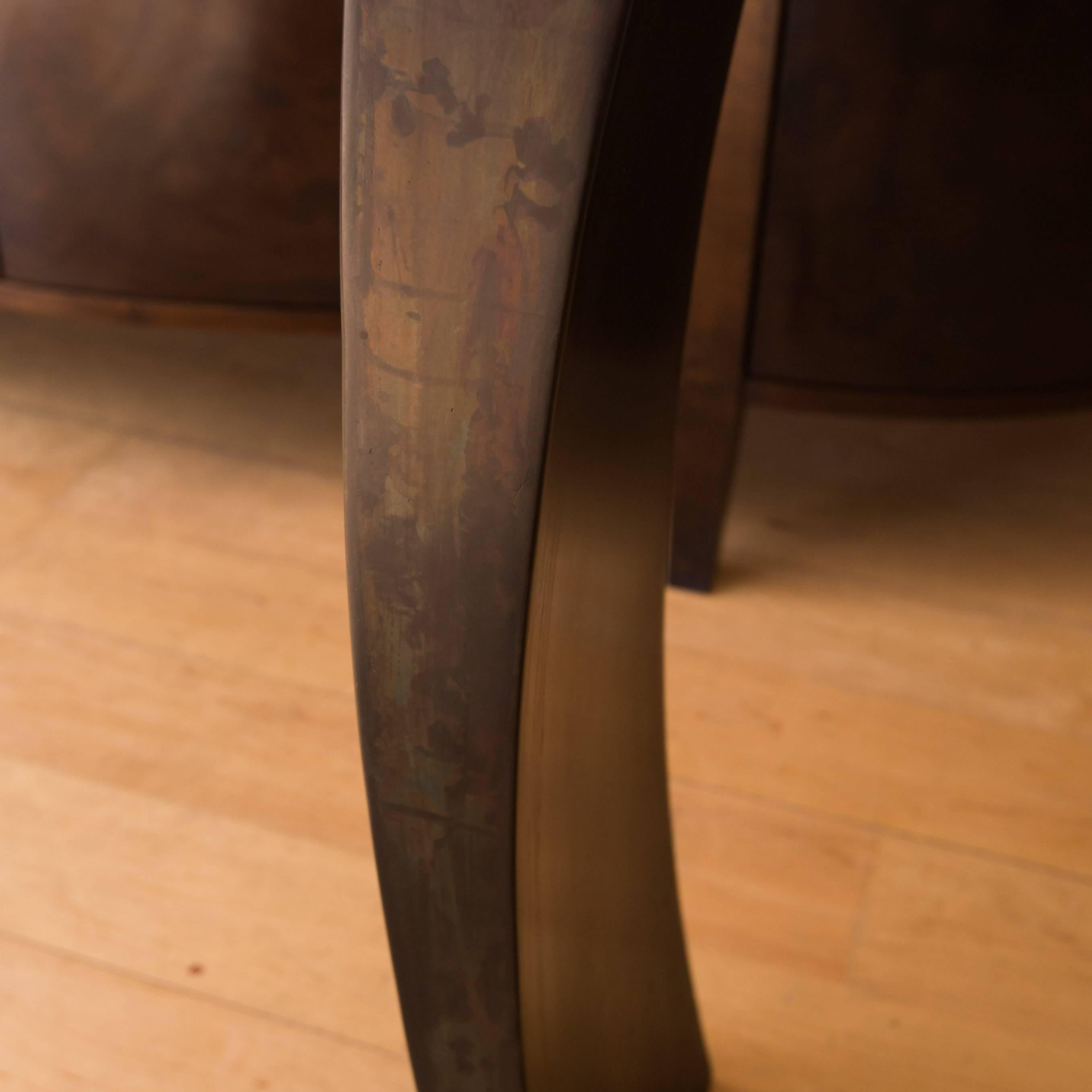 This accent piece, designed and built by Connecticut master furniture maker Gregory Clark, will be noticed in any room it's placed. This console table features a Ziricote wood top secured between two patinated hand-formed steel legs.