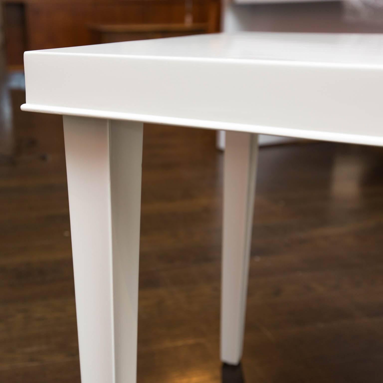 Simple, tapered leg side table that has been freshly lacquered in white dove gloss.