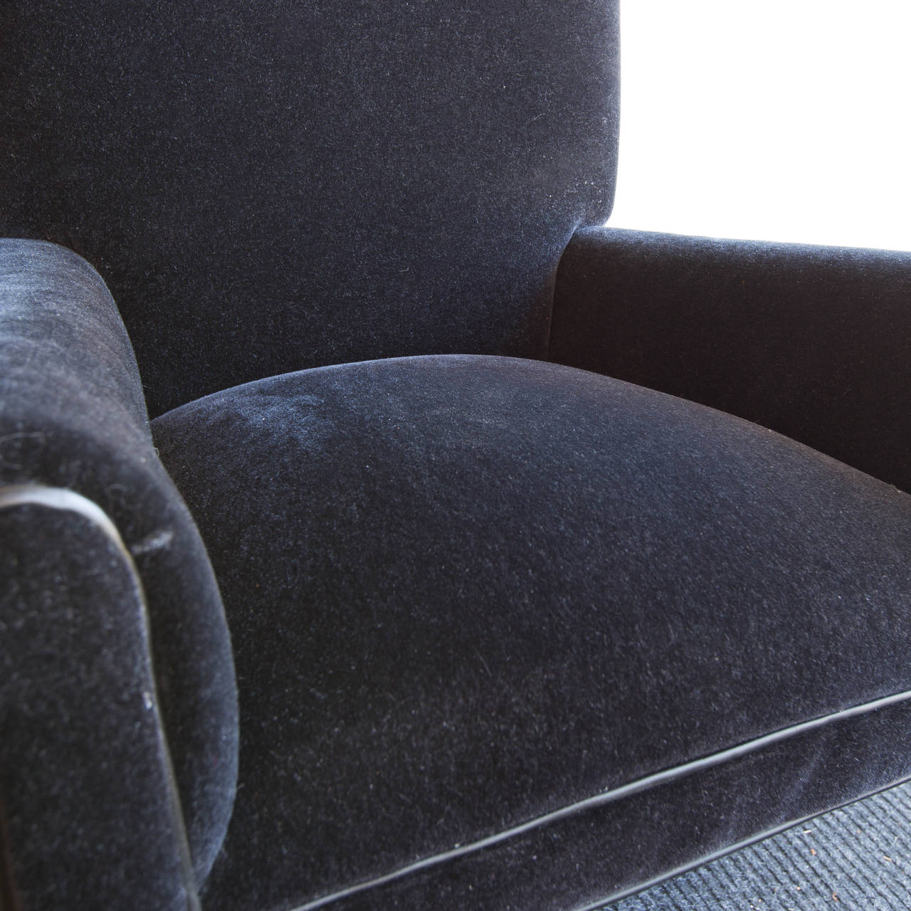 Beautiful as it is rare, this dark navy blue mohair desk chair by Mitchell Gold is trimmed in grey kidskin leather.