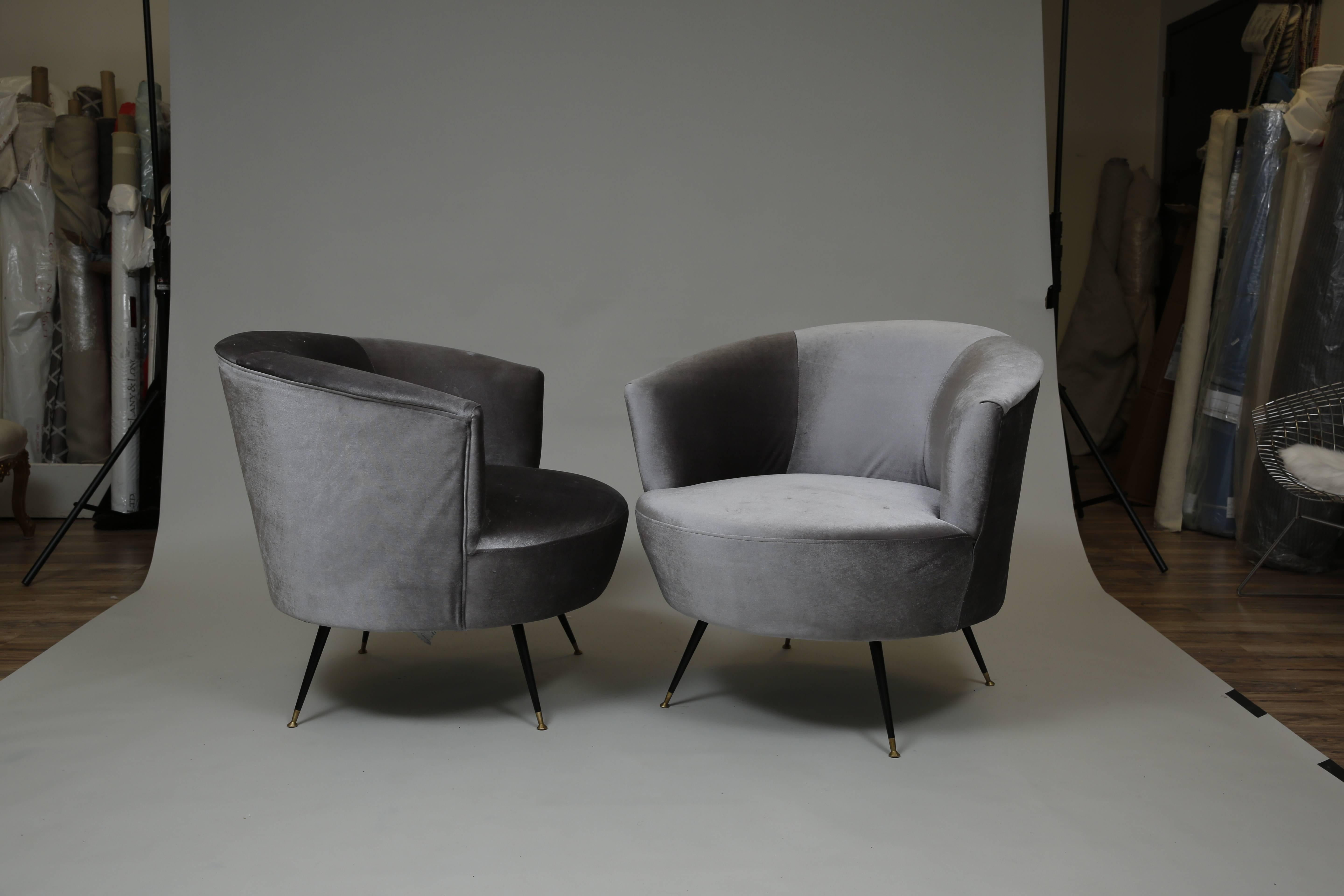 Italian influenced set of chairs newly reupholstered in graphite grey Kravet velvet with original brass tipped splayed legs.