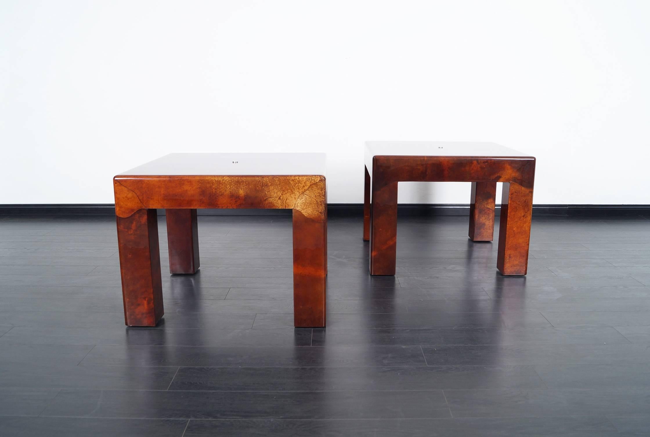 An exceptional pair of Parsons side tables designed by Karl Springer. Made with free-form inlay of natural goatskin and sealed with polyester lacquer. Top quality craftsmanship.