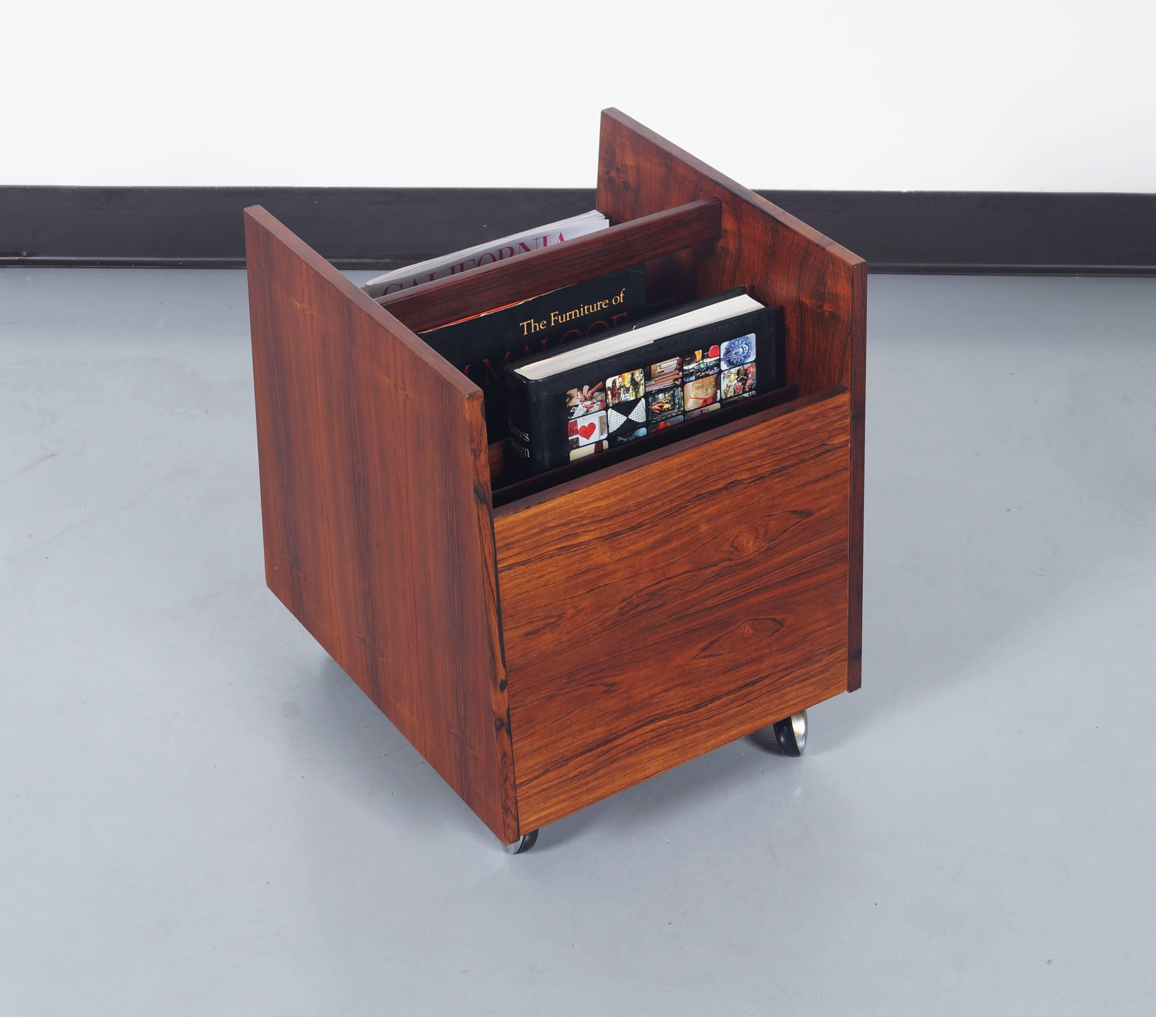 Danish modern rosewood rolling magazine stand by Rolf Hesland for Bruskbo Norway. Can also be used to store records.