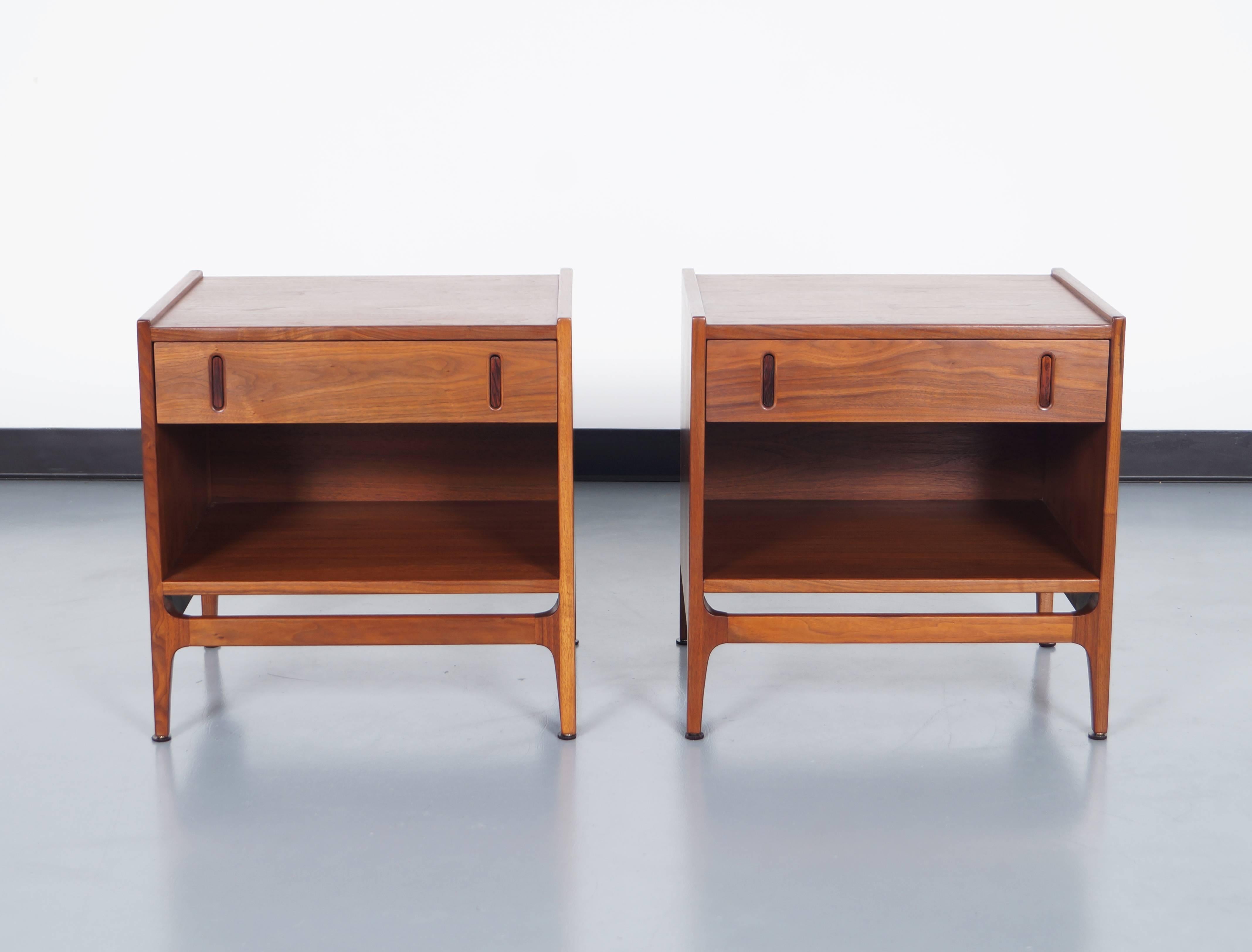 Fabulous nightstands designed by Richard Thompson for Glenn of California. Made in walnut with sculptural rosewood pulls.