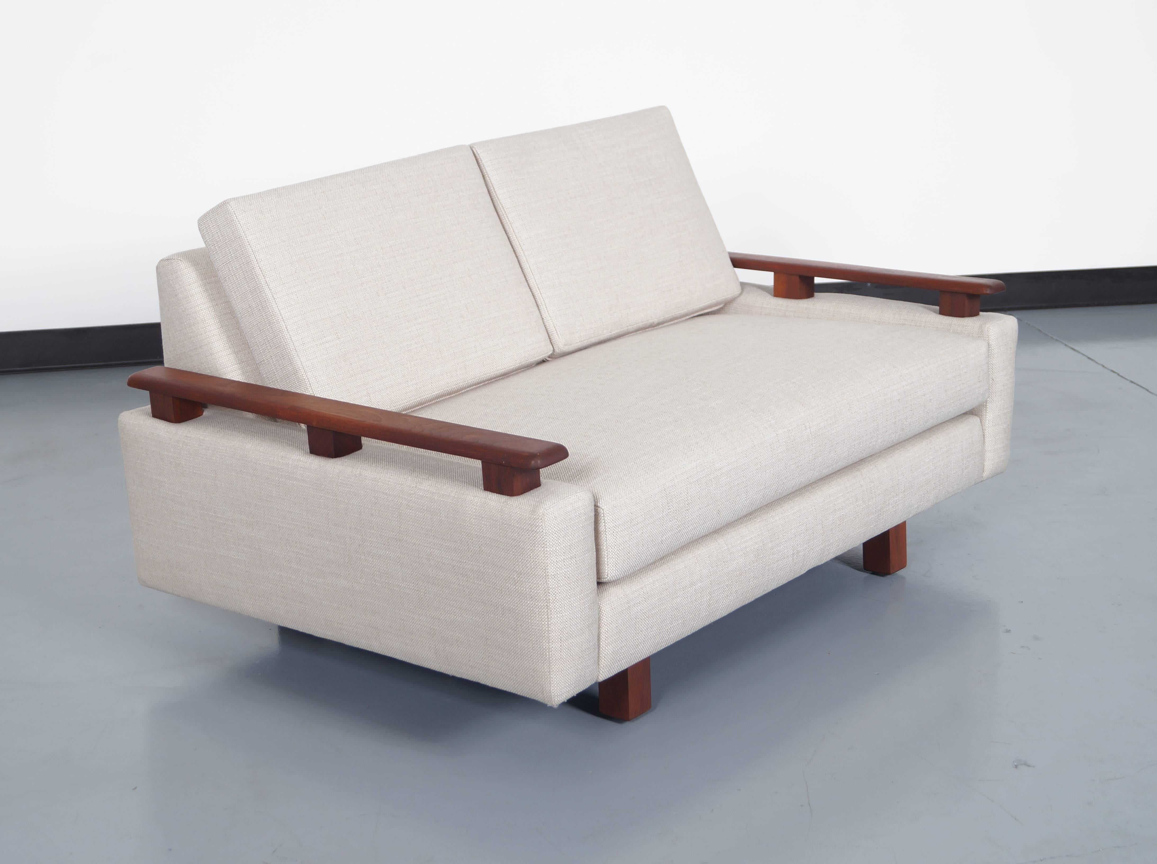 Mid-Century Modern loveseat. Features excellent walnut details and beautiful lines.