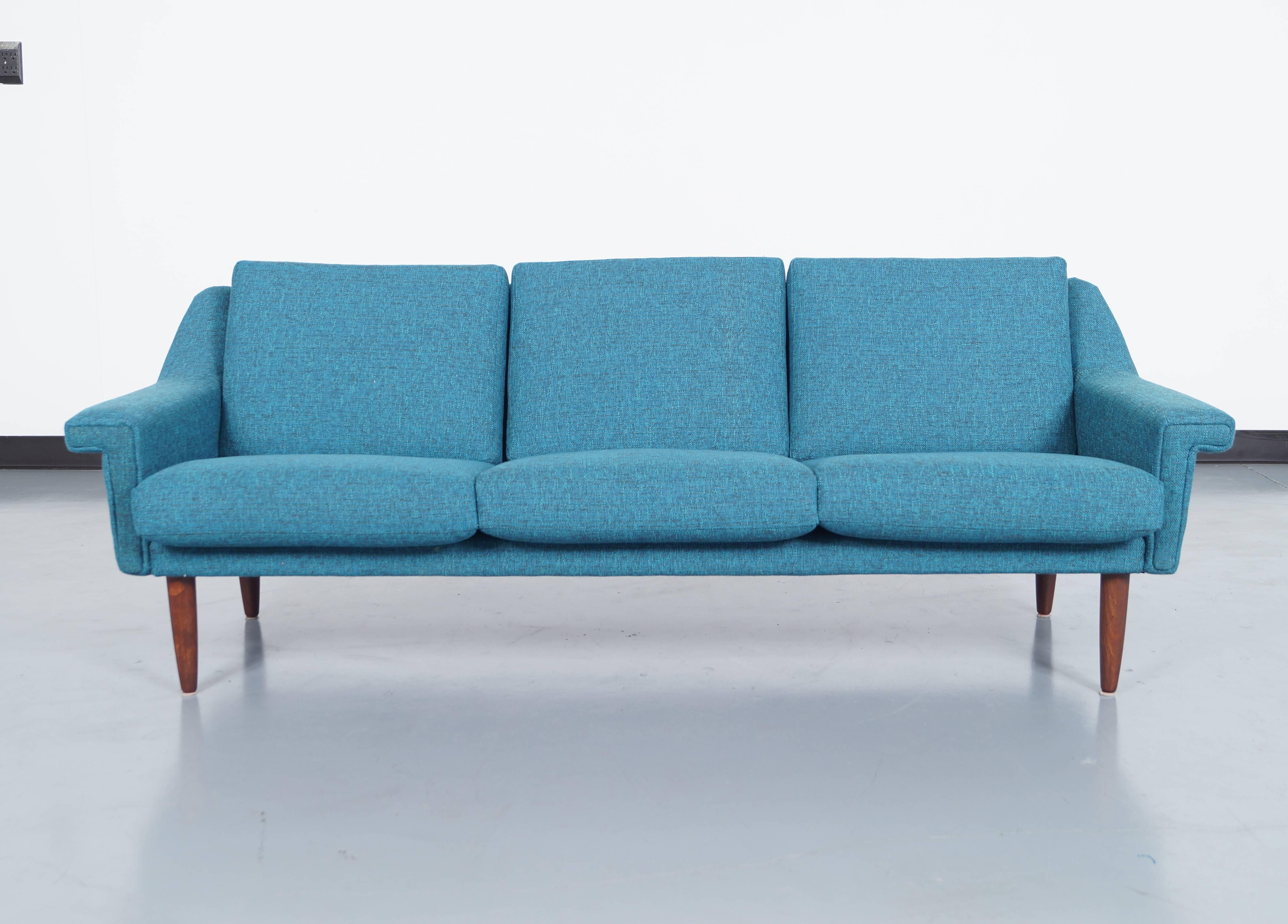 Danish modern sofa attributed to Hans Wegner. Cushions contain original coil springs for superior comfort.