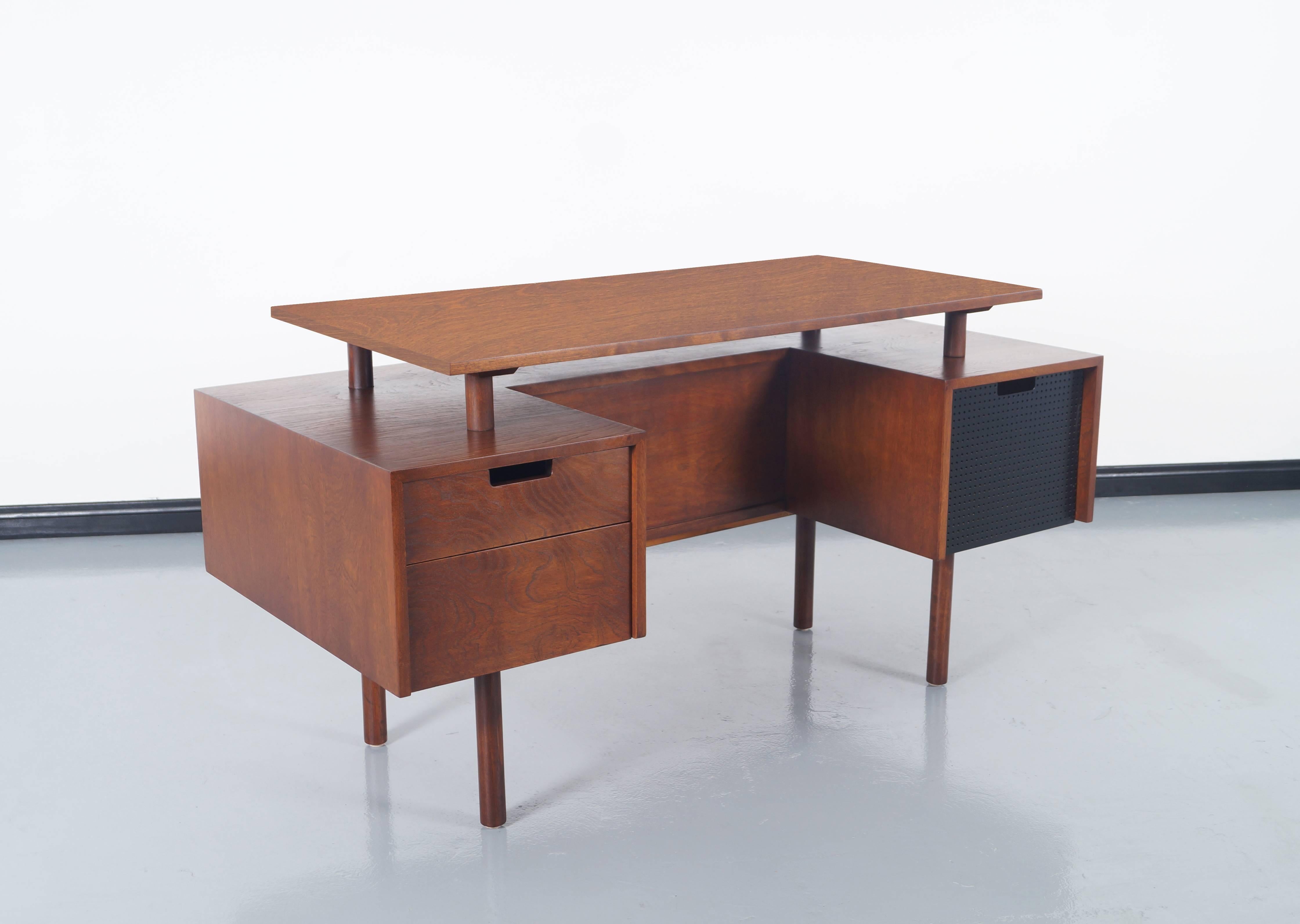 An early and rare floating top desk designed by Milo Baughman for Glenn of California. Features two drawers on the left side and one file cabinet to the right. A storage space for display. Branded with maker's mark.