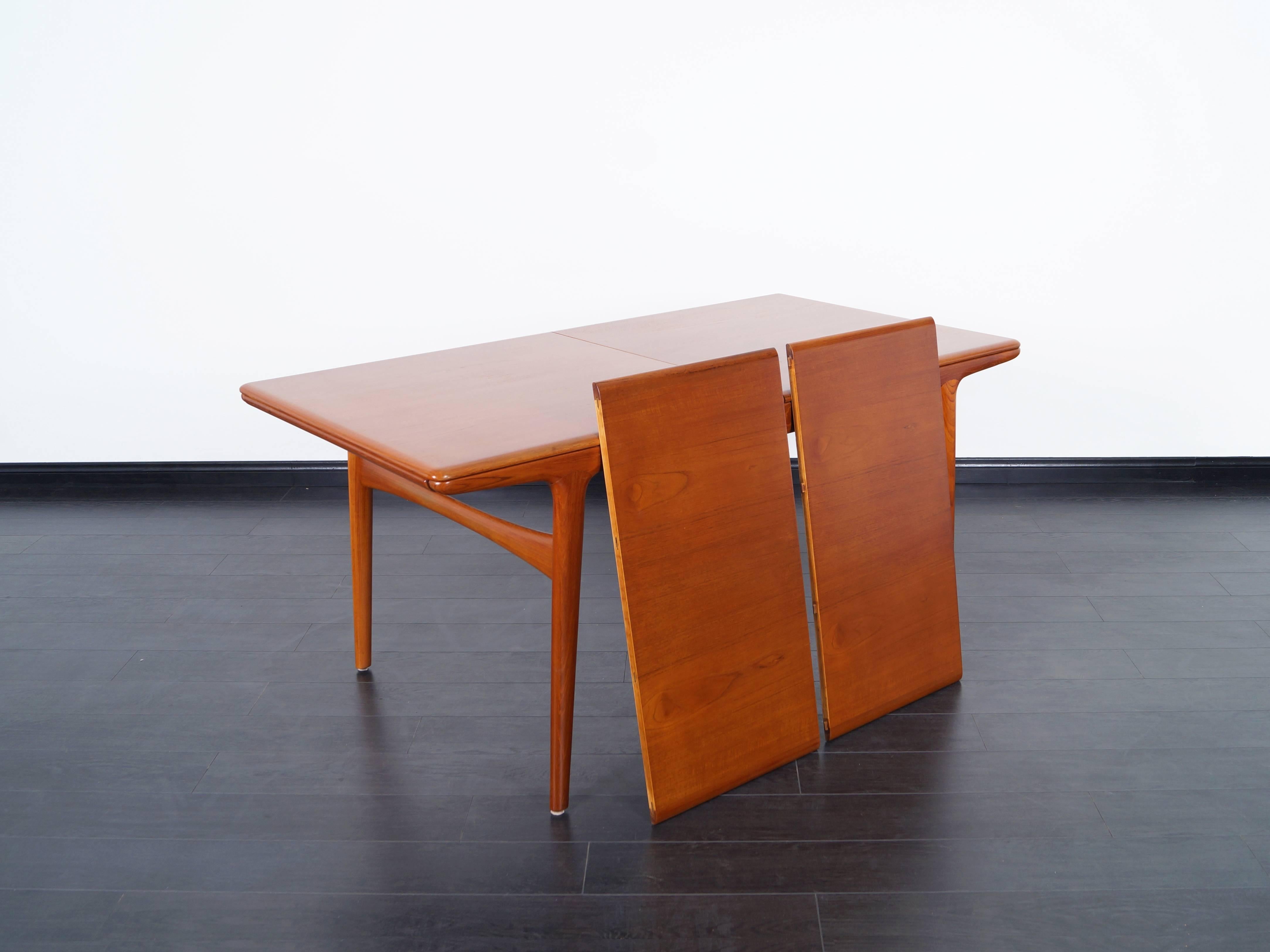 Danish modern teak dining table designed by Arne Hovmand-Olsen. Can be expand up to 97.5
