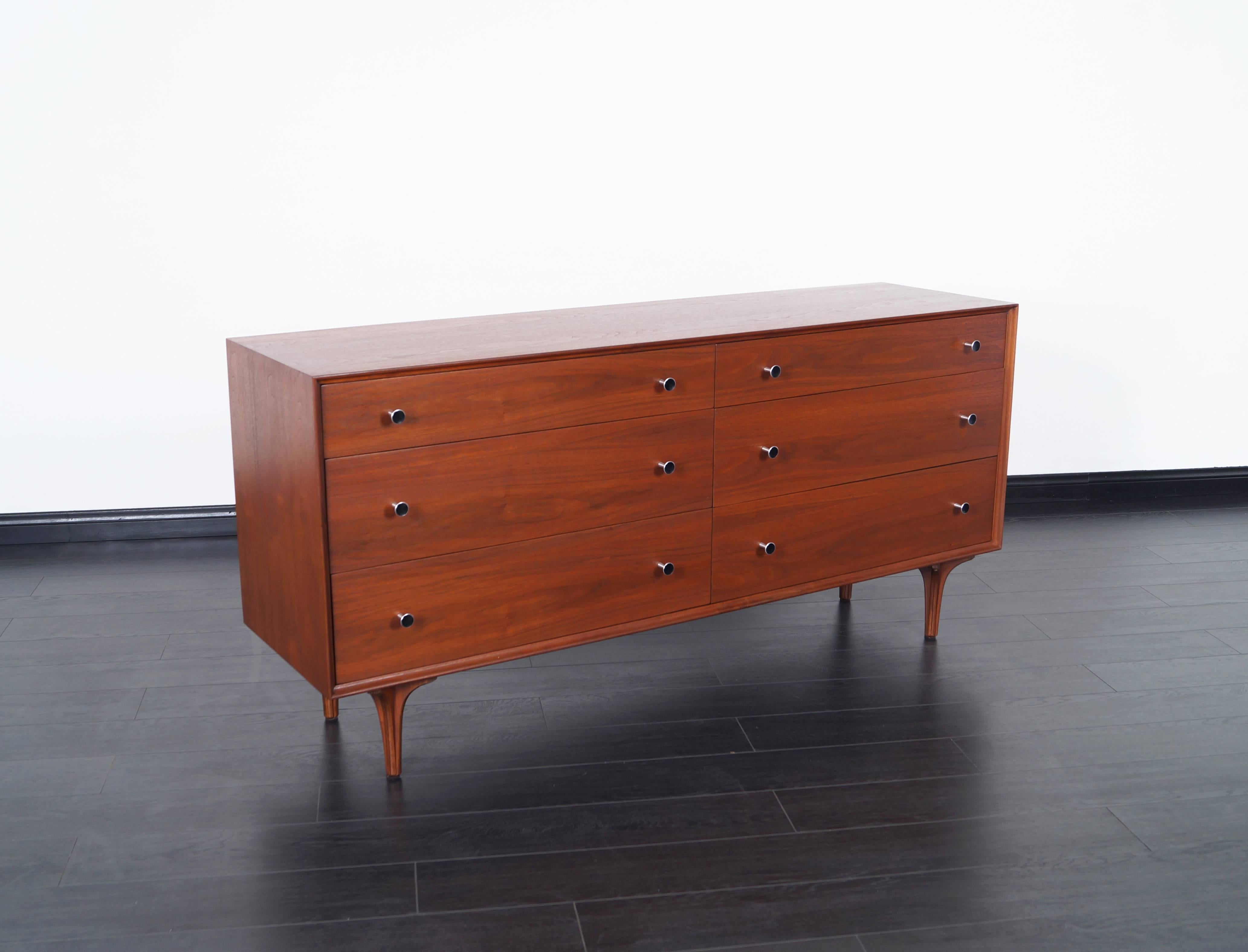 Vintage walnut dresser designed by Robert Baron for Glenn of California. Features six dovetail drawers with original aluminum pulls.