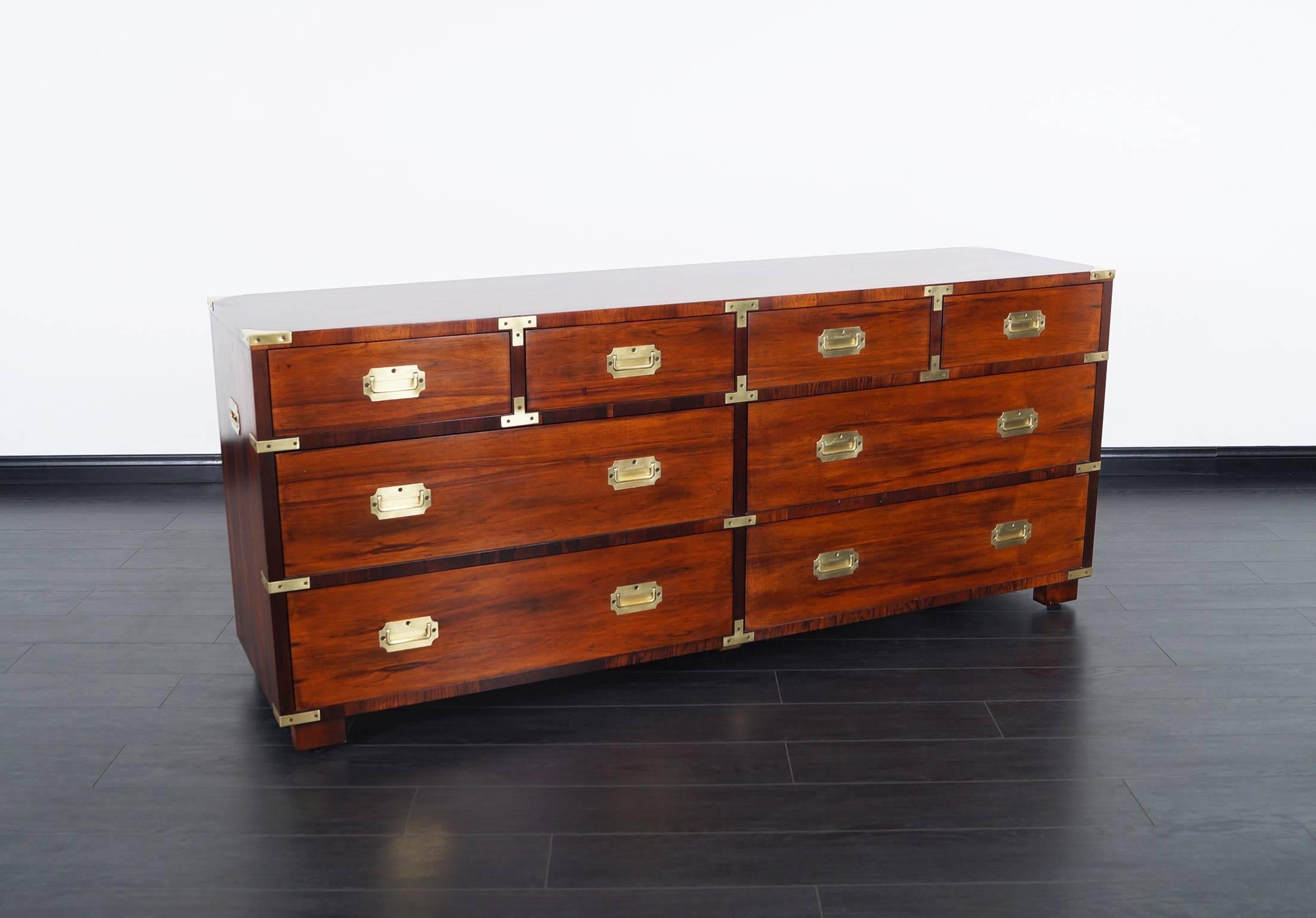 Stunning Brazilian rosewood Campaign style dresser by John Stuart. Features eight drawers with solid brass hardware. This is absolutely one of the most well crafted Campaign style dresser ever made, with no expense spared.