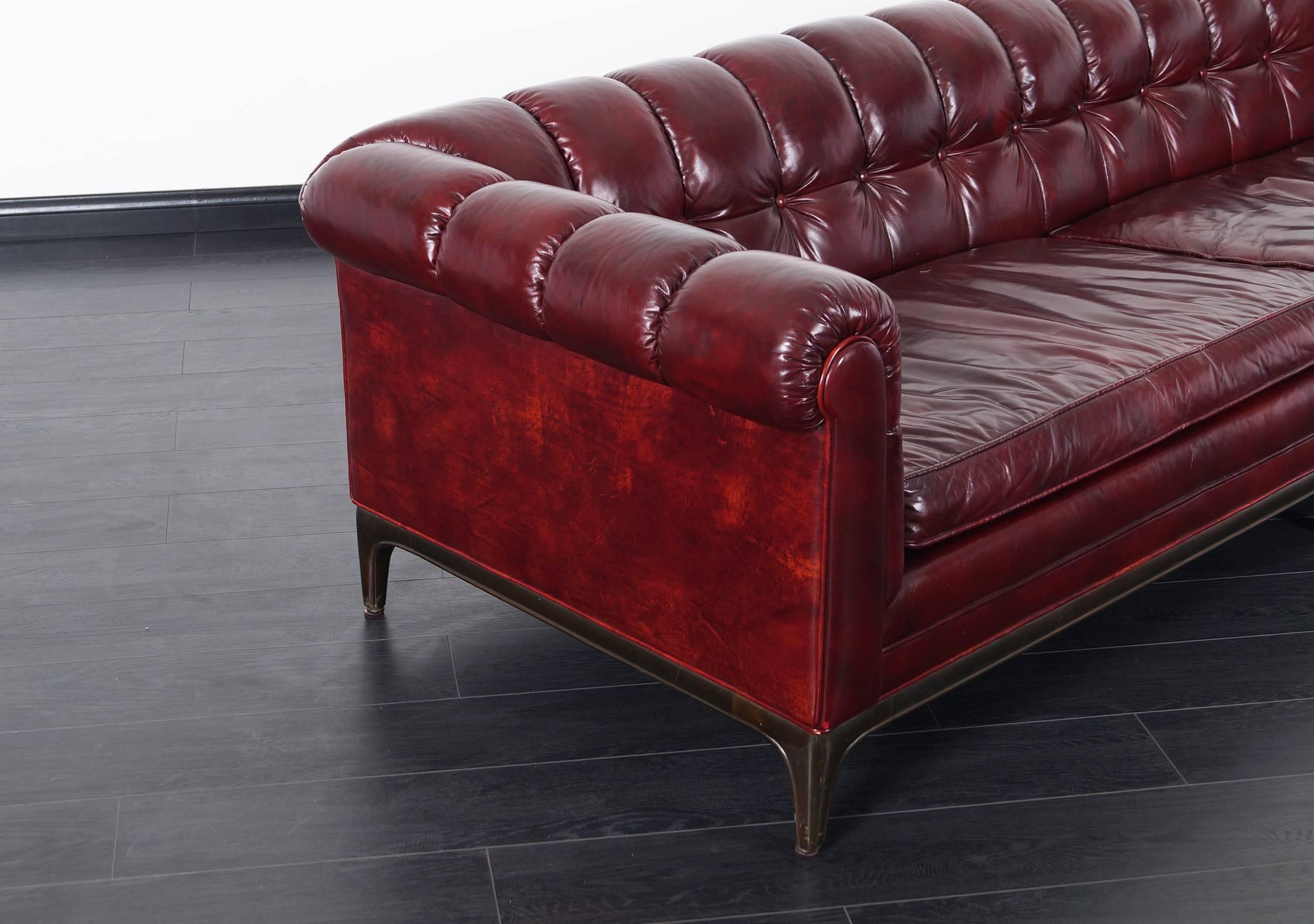 red tufted leather sofa