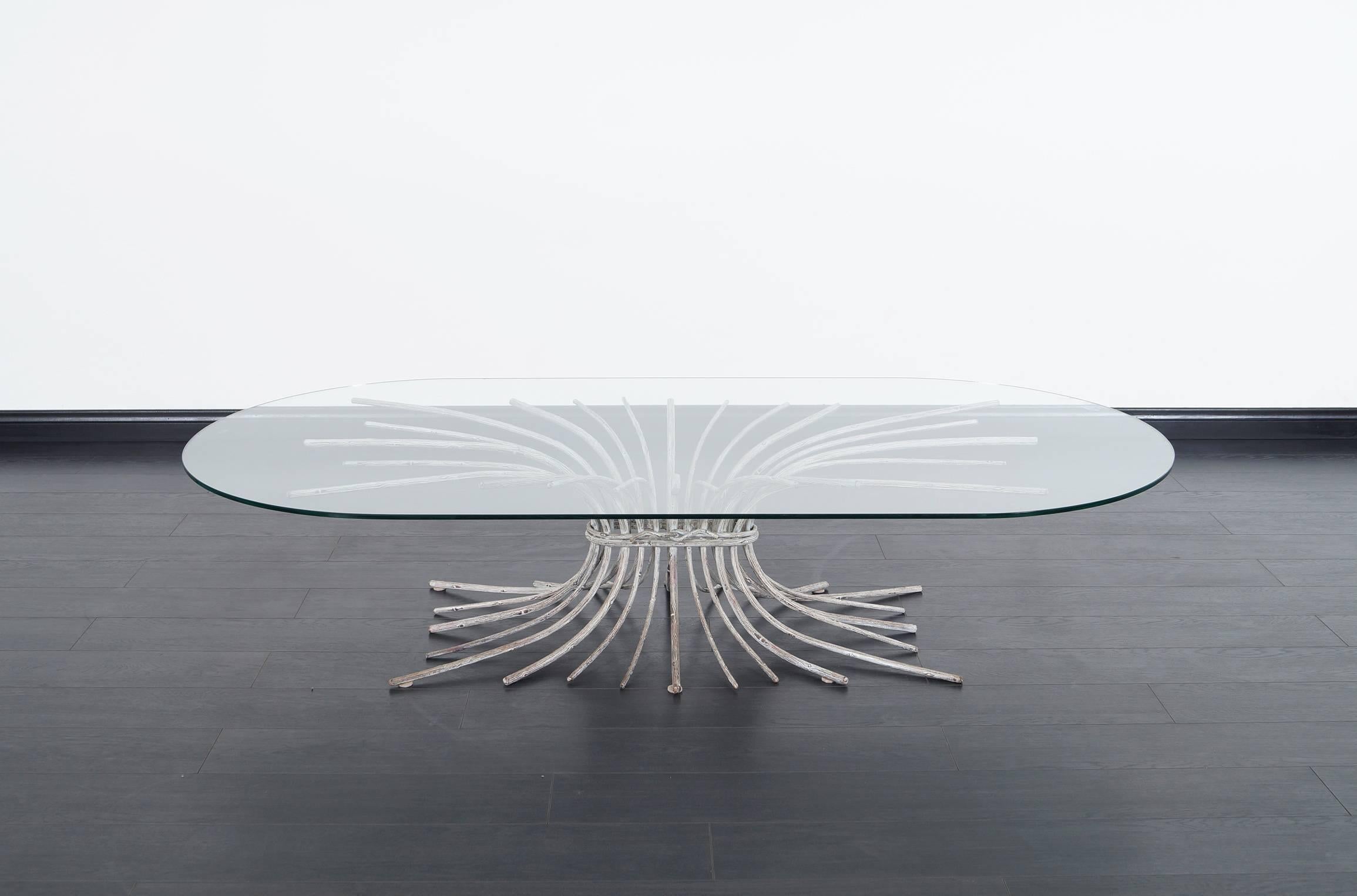Exceptional vintage bronze “Tree” sculpture coffee table, circa 1960s. This coffee table features a structurally designed base in the shape of a tree trunk. The solid bronze base stands out for its abstract design and defined lines throughout its