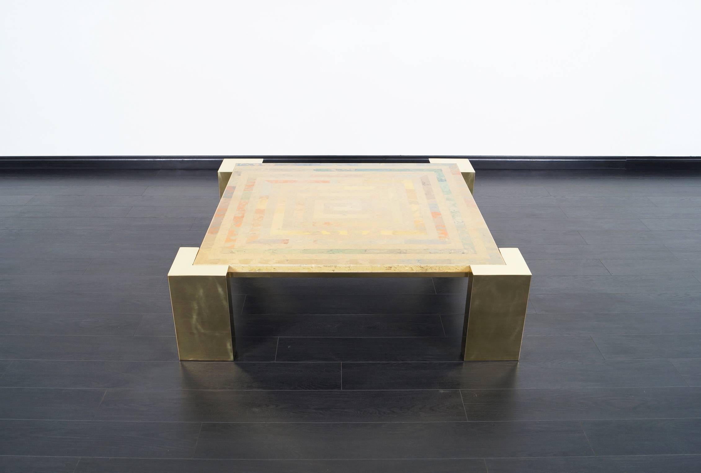 This stunning vintage Italian brass coffee table was designed by Marcello Mioni. Features a geometric design in the travertine.