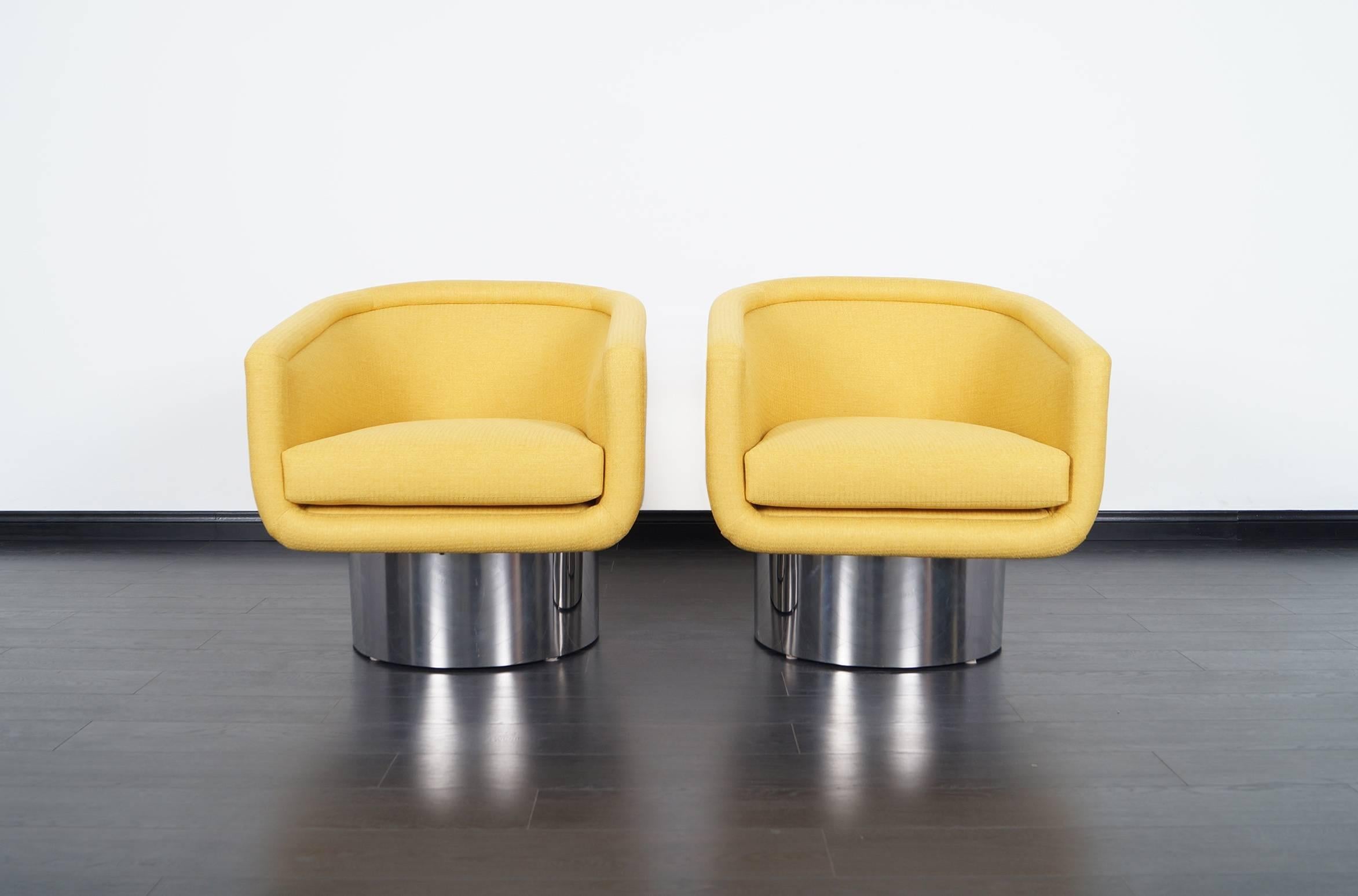 Pair of stunning chrome swivel lounge chairs designed by Leon Rosen for Pace collection.