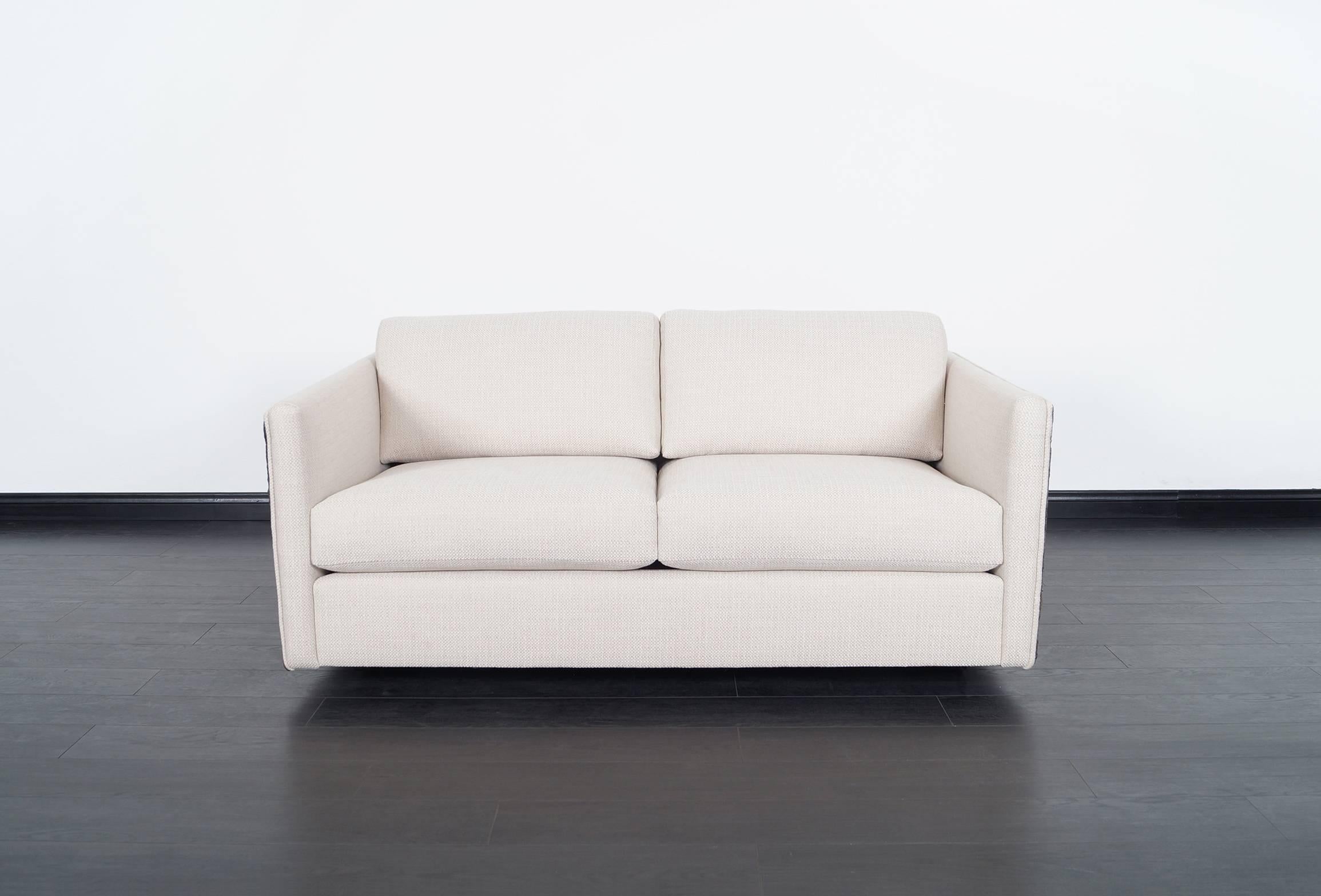 This fabulous Brutalist loveseat was designed by Adrian Pearsall for Craft Associates.
