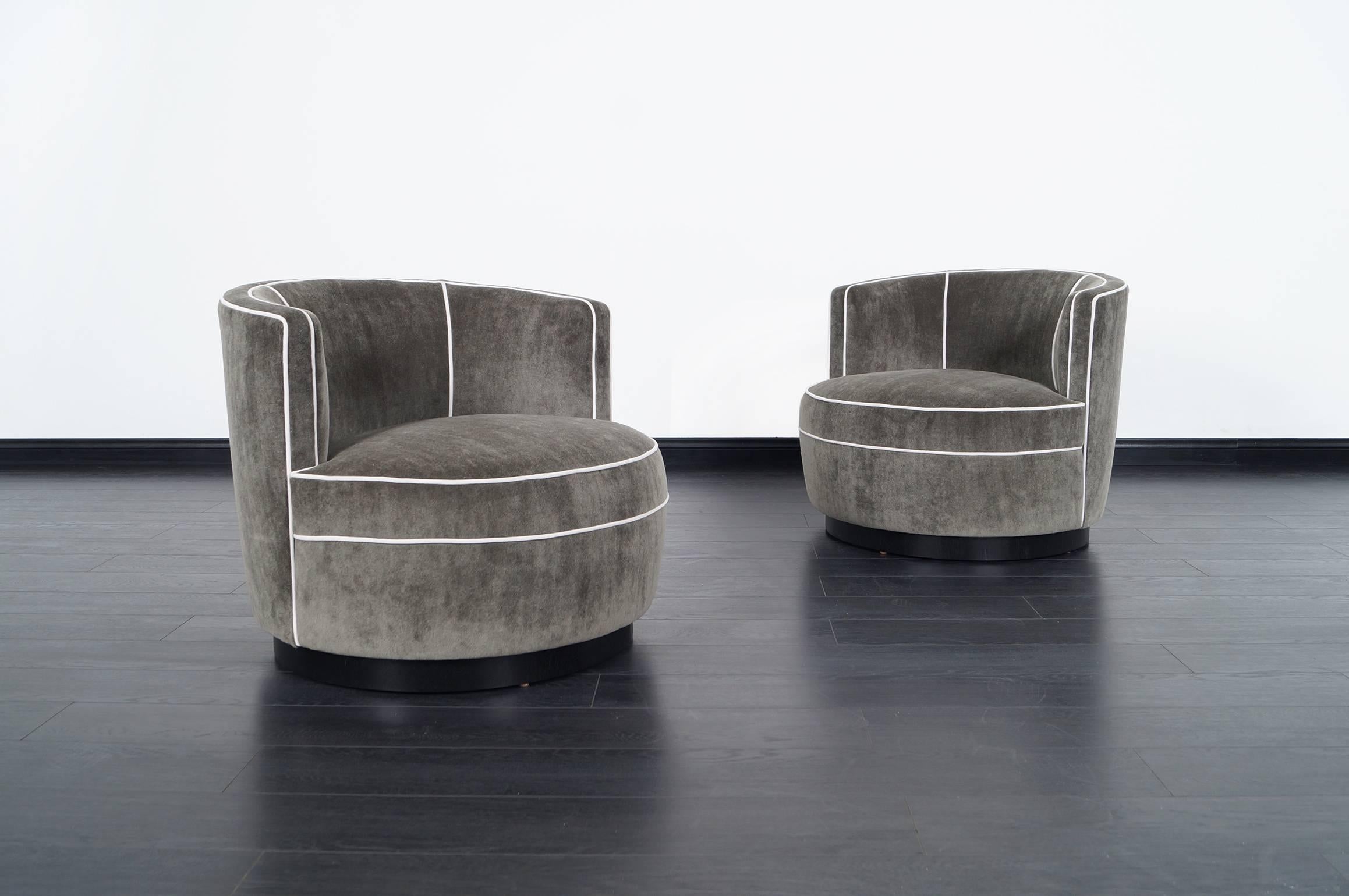 Pair of stunning swivel lounge chairs designed by Edward Wormley for Dunbar. Newly reupholstered in mohair.