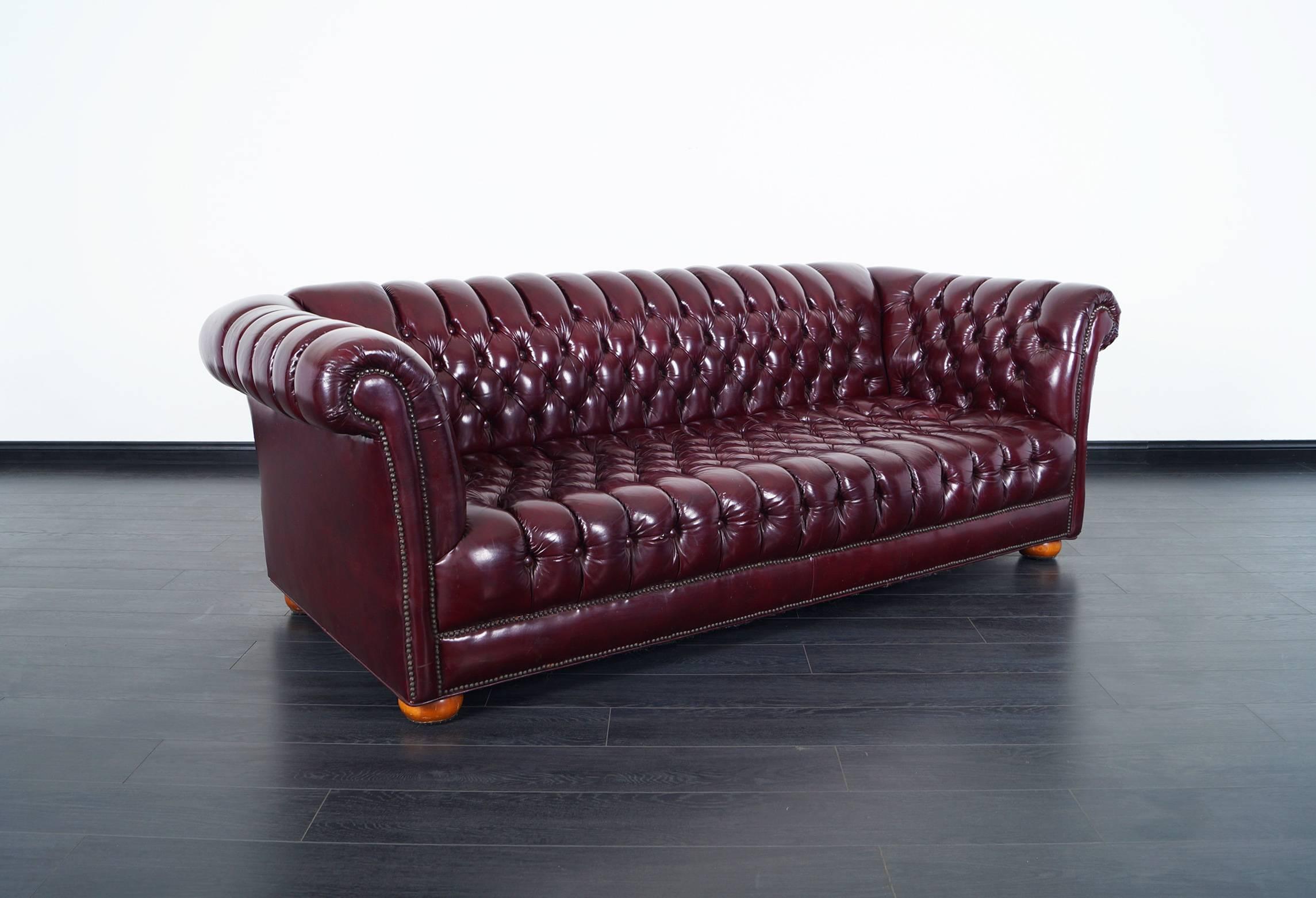 Fabulous vintage burgundy leather Chesterfield sofa.