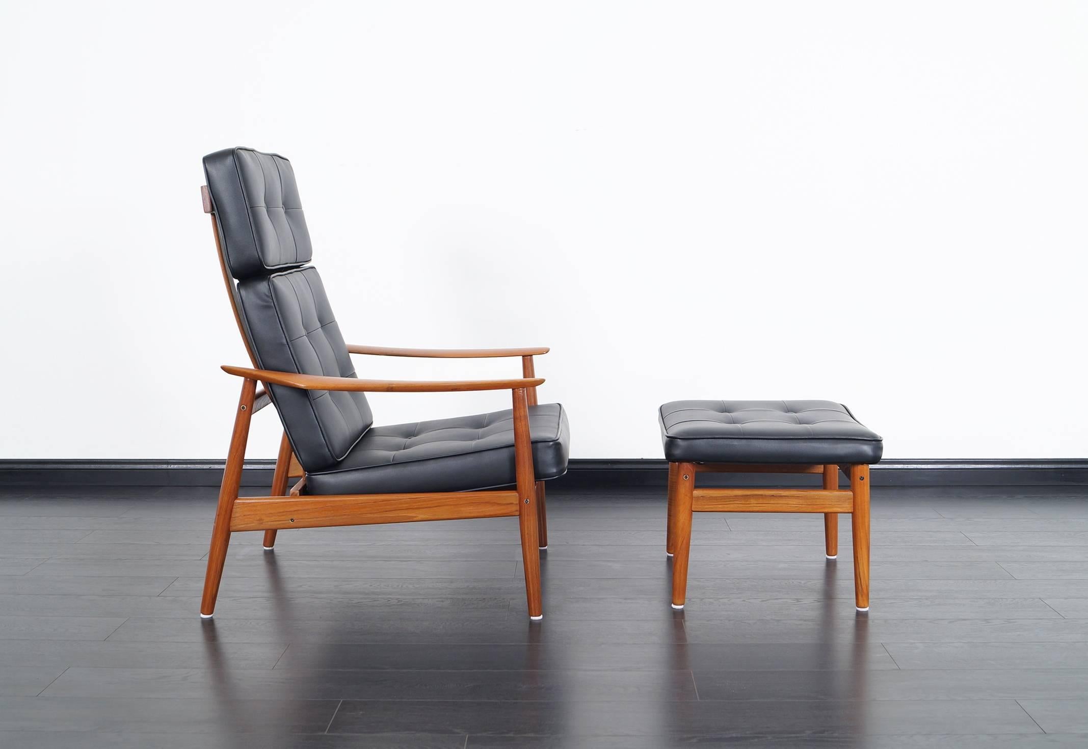Stunning danish reclining lounge chair and ottoman, model FD-164, designed by Arne Vodder for France and Son. This recliner features three recliner positions for superior comfort. The frame is constructed from solid teak which gives it a very nice