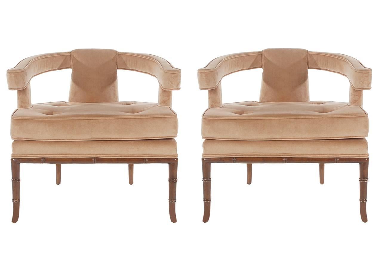 A handsome matching pair of lounge chairs circa 1960s. They feature solid wood faux bamboo legs with new taupe colored peacock velvet. 

In the style of: Harvey Probber, James Mont.