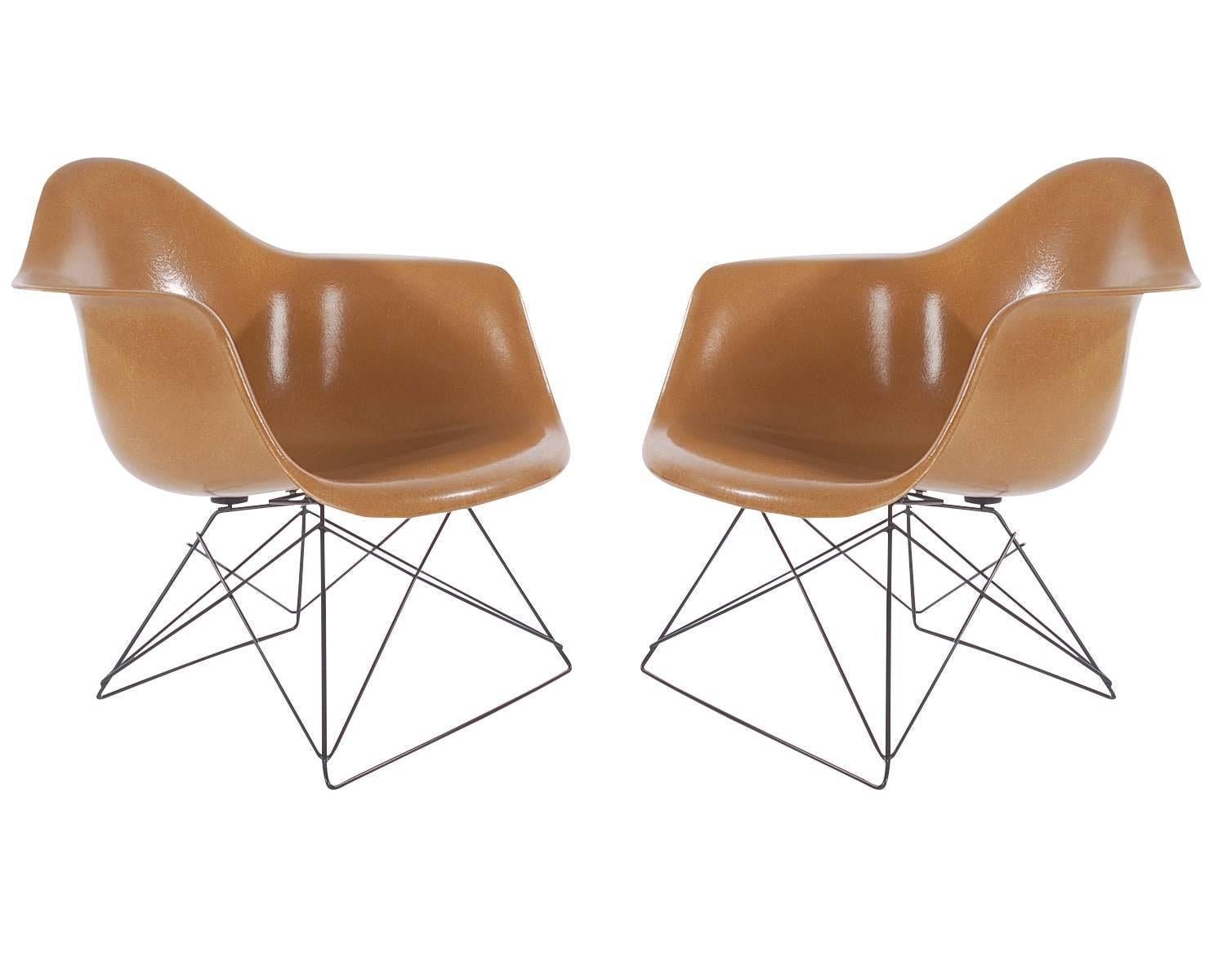 A matching pair of low sitting lounge chair shell chairs designed by Charles Eames for Herman Miller. Very uncommon 
