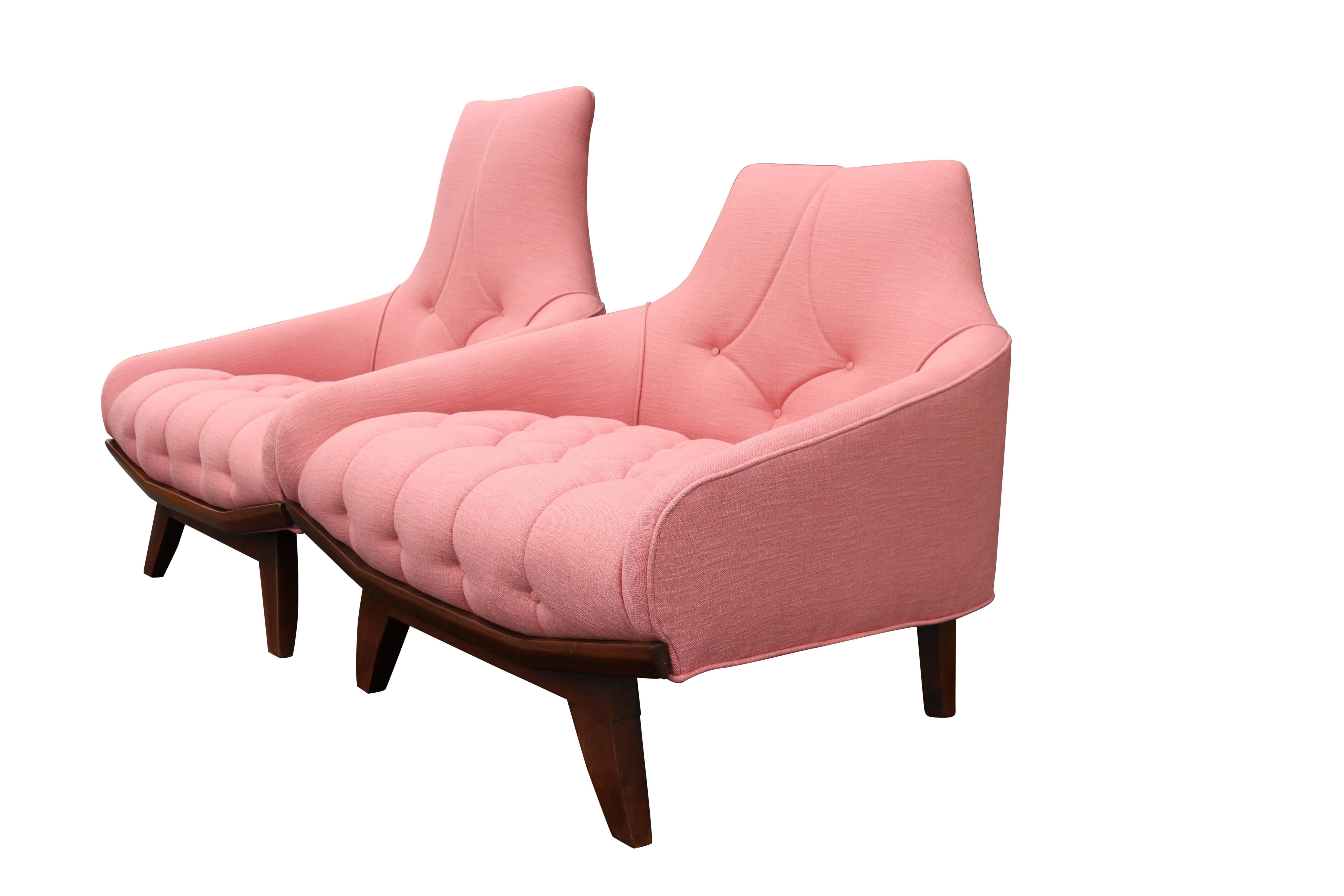 This lovely pair of Mid-Century Modern gondola chairs has been lovingly restored and covered in pink linen. Ample in size these would be a comfortable and fun addition to any decor. Smaller chair is 32 inches high, 36 wide, 32 deep with a 17.5 inch