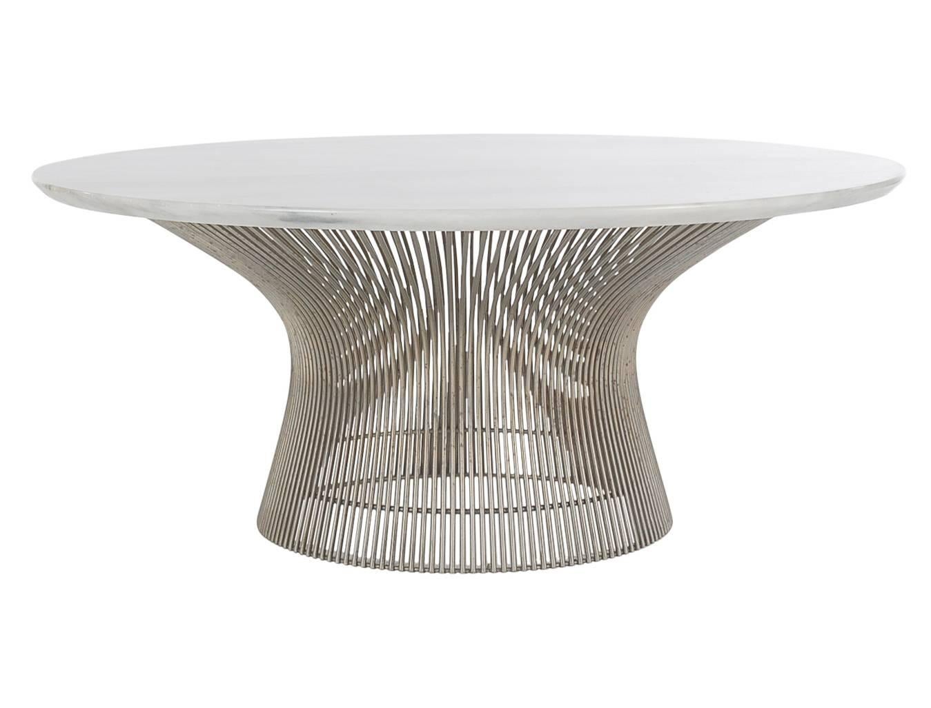 A classic design from one of the masters. This circa 1960's cocktail table features a sculptural wire base with heavy marble top. 