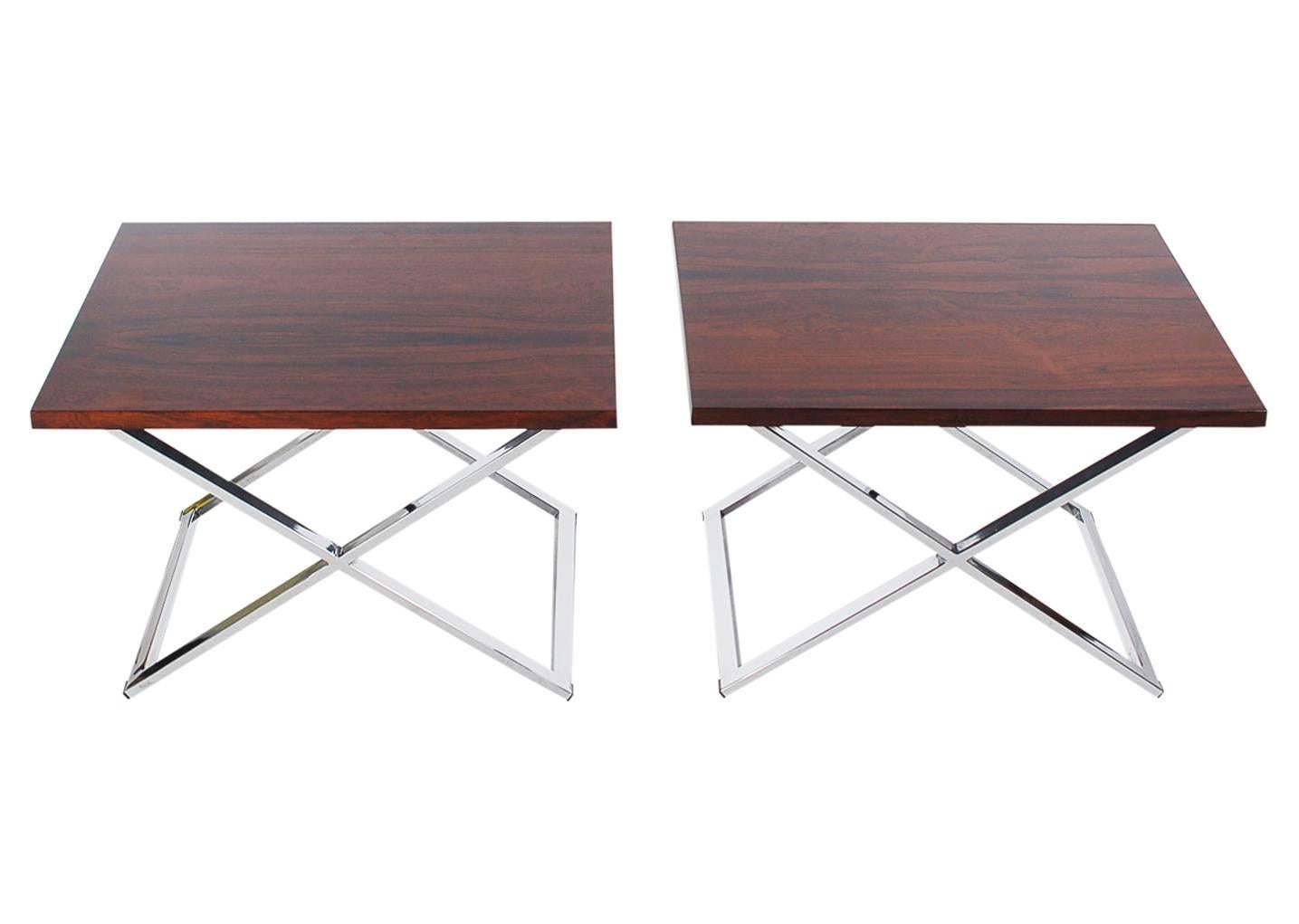A handsome pair of X-base tables attributed to Milo Baughman for Thayer Coggin. They feature polished chrome bases with beautifully grained rosewood tops. Price includes the pair.