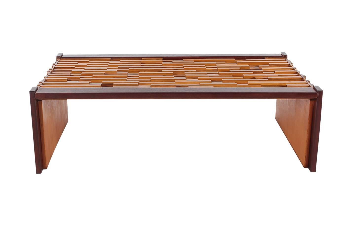 A classic Brazilian design by Percival Lafer. It features mixed wood blocks with rosewood edges and glass top. Excellent well cared for condition.