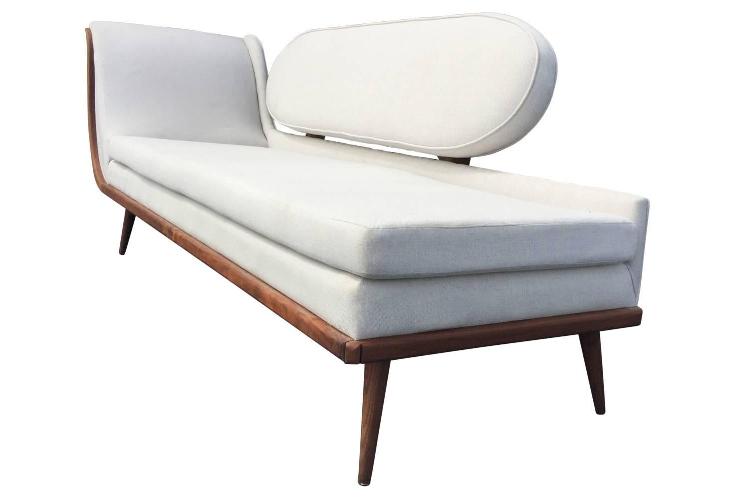 Manufactured in the 1950s for Cimon of Montreal, this rare sofa is a showstopper! Sturdy construction, a teak frame, and linen upholstery make this piece both beautiful and functional. Very light evidence of age and use.