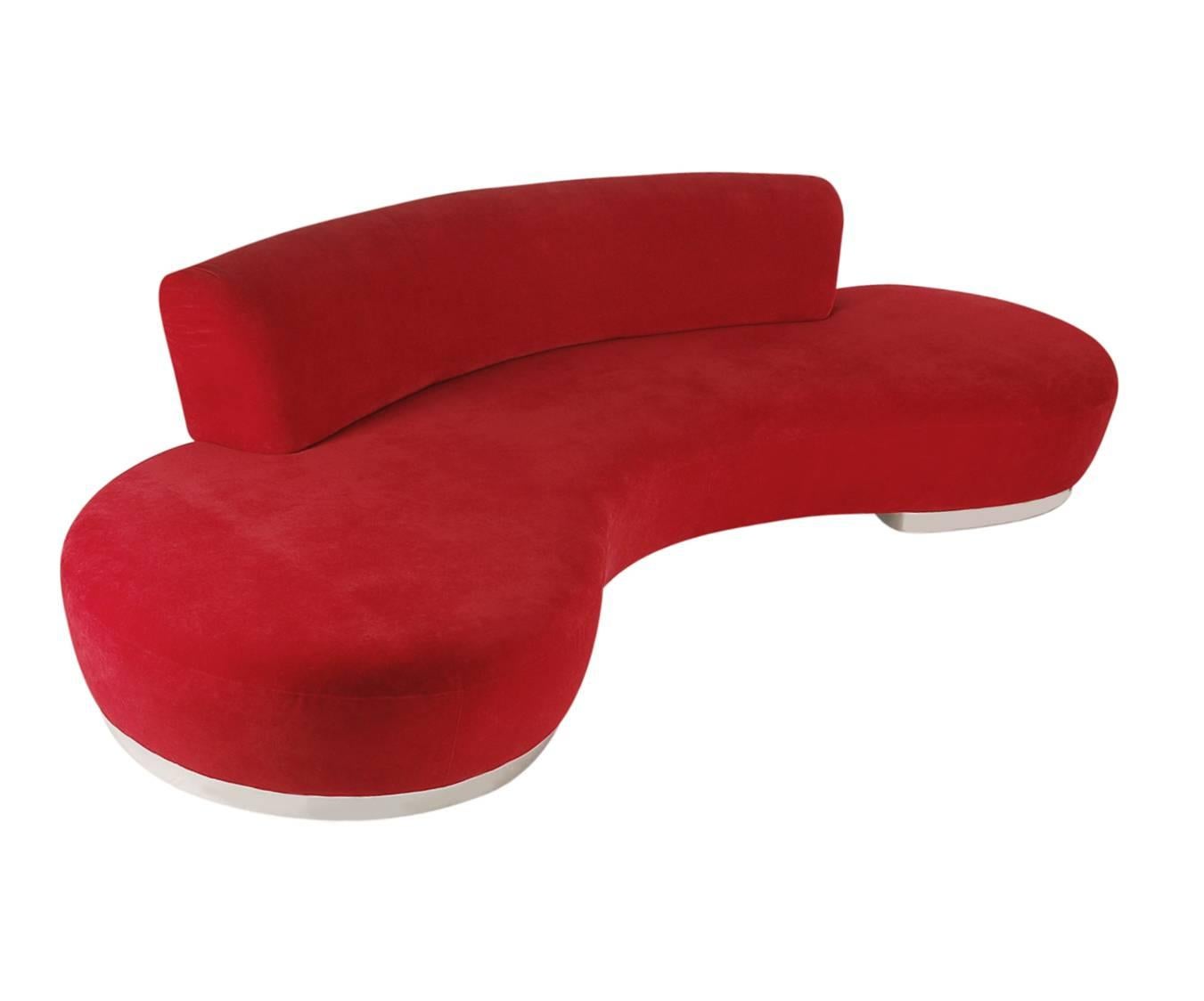 A monumental sculptural sofa attributed to Vladimir Kagan. It was manufactured in the 1980s and recovered in the early 2000s with a faux red velvet. In nice clean ready to use condition.